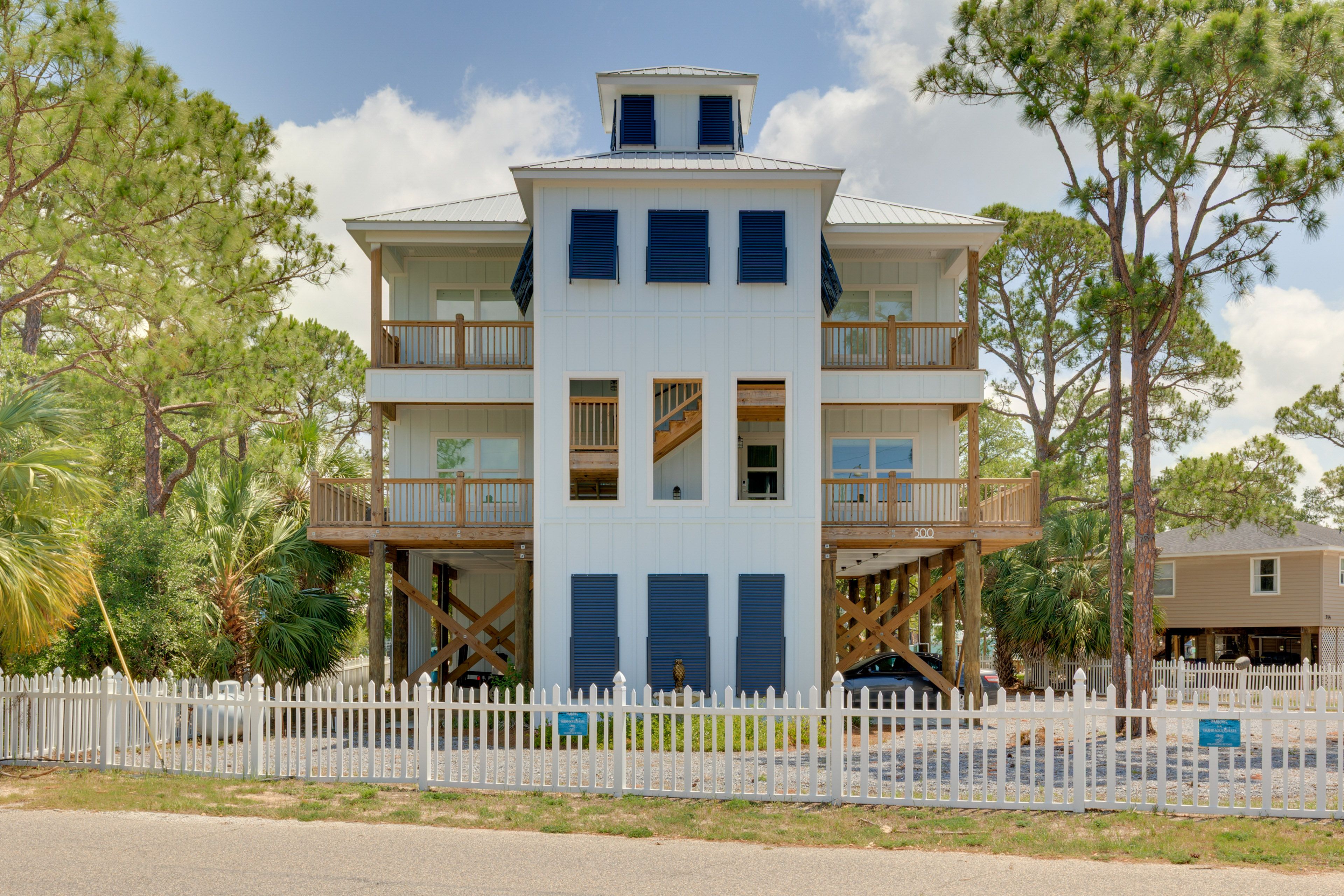 Condo Exterior | Community Boat Dock | Grill | Outdoor Dining Areas