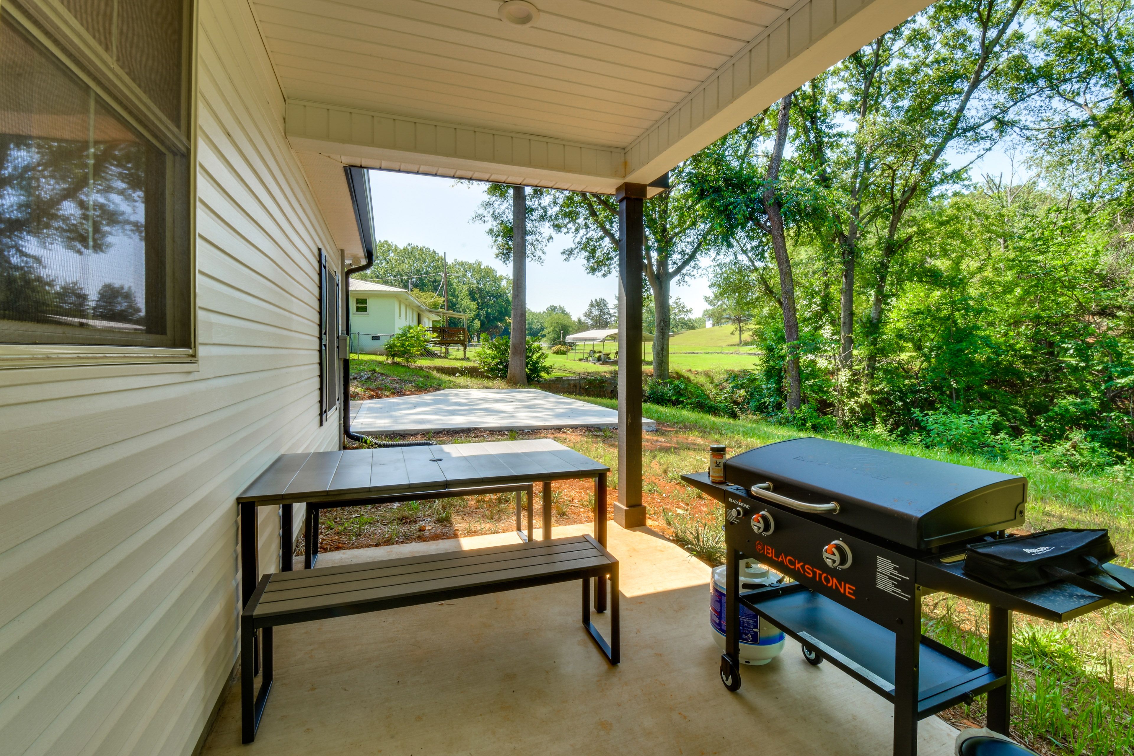House Exterior | Covered Patio | Dining Area | Gas Griddle | Private Yard