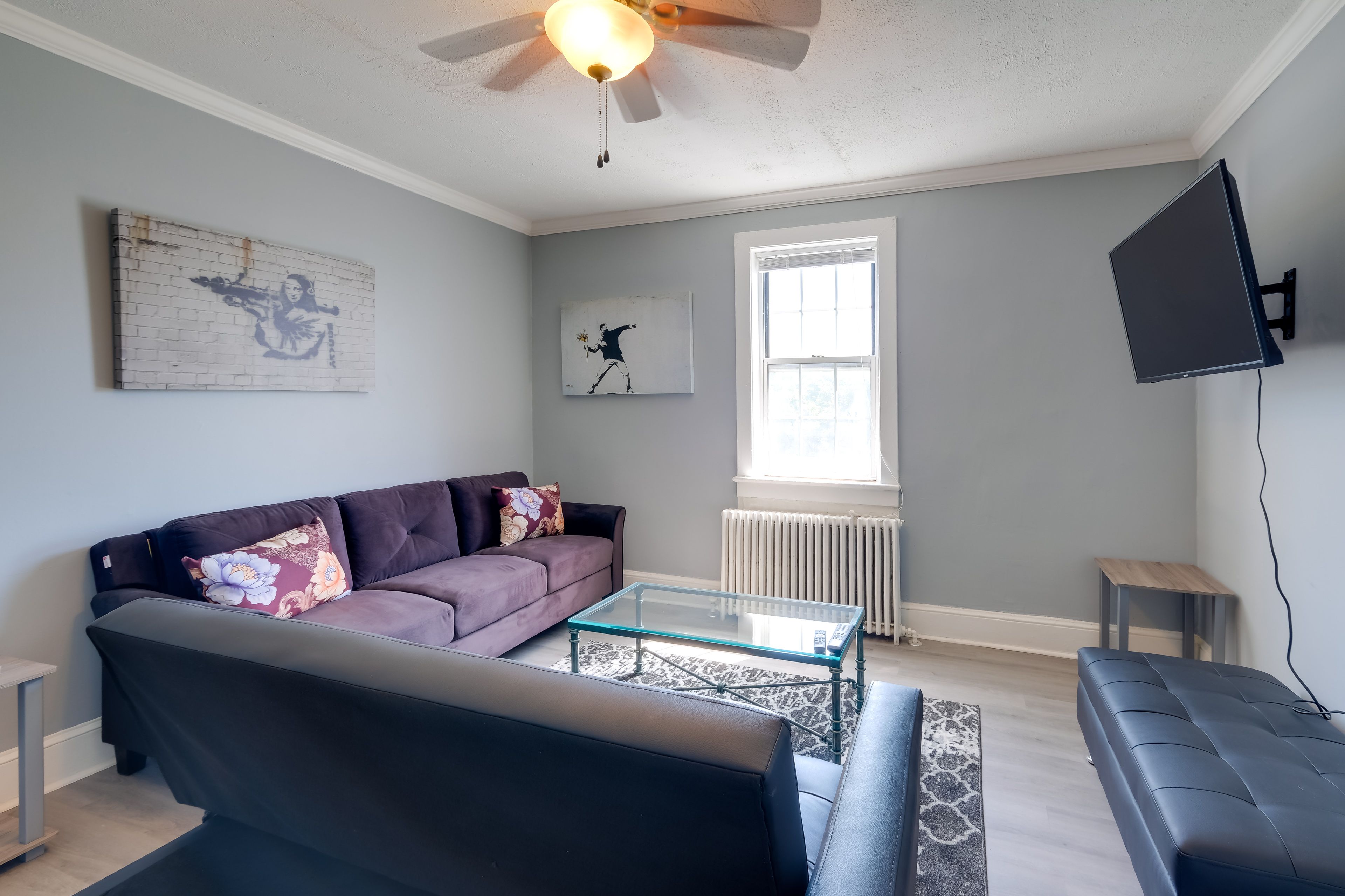 Living Room | Full Futon | Window A/C Unit | Central Heating | Smart TV