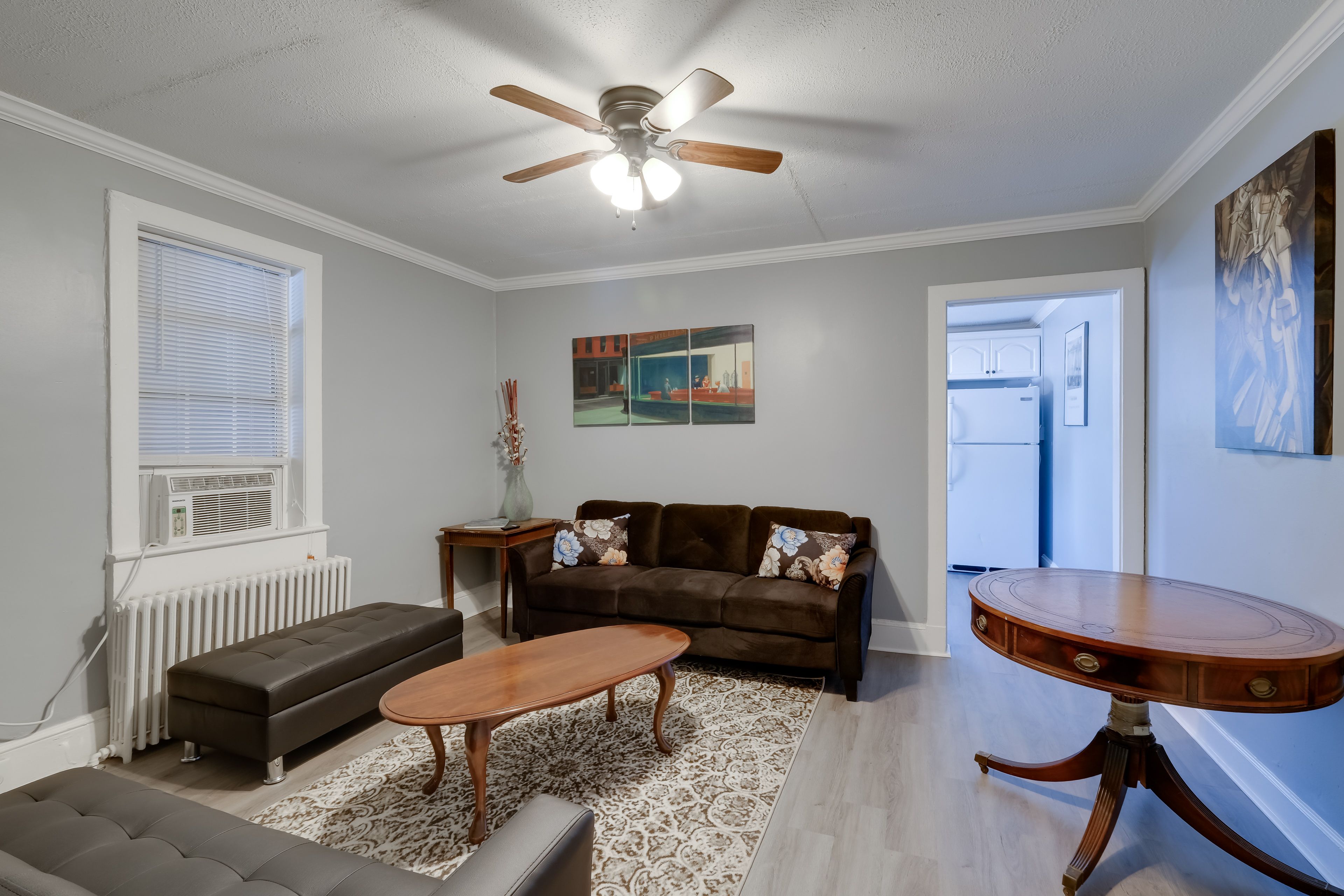 Living Room | Full Futon | Window A/C Unit | Central Heating