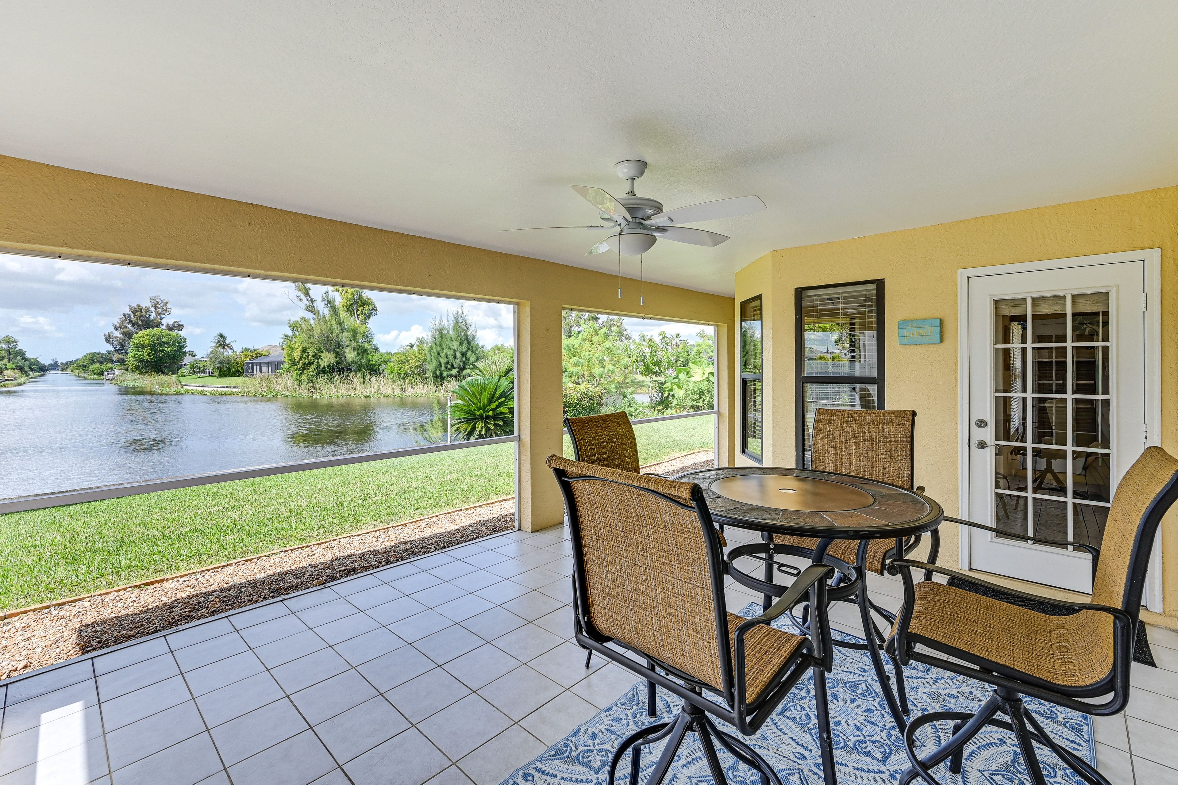 Screened-In Lanai | Dining Table | Water Views | Gas Grill | Spacious Yard