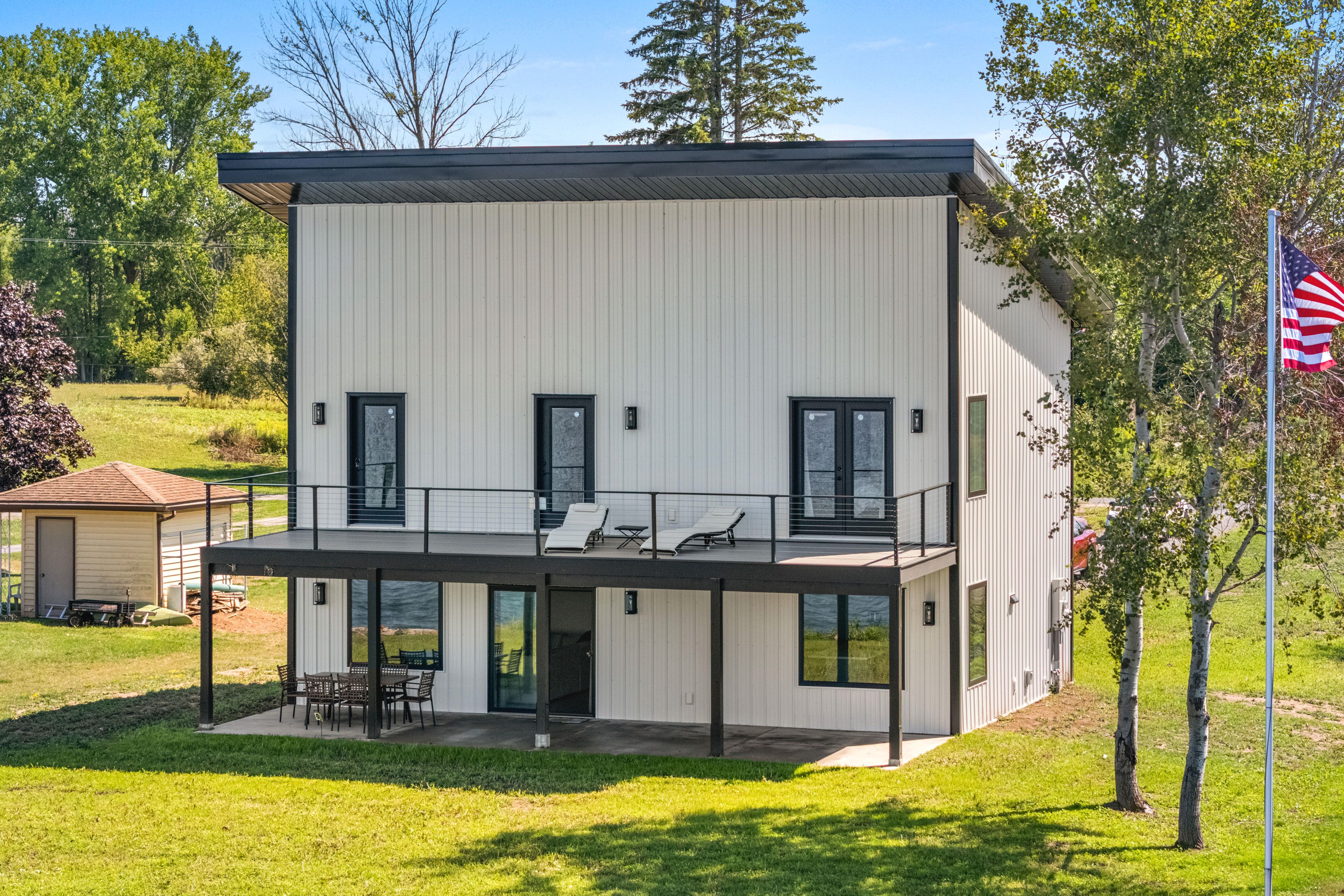 Property Exterior | Covered Patio w/ Dining Area | Private Yard
