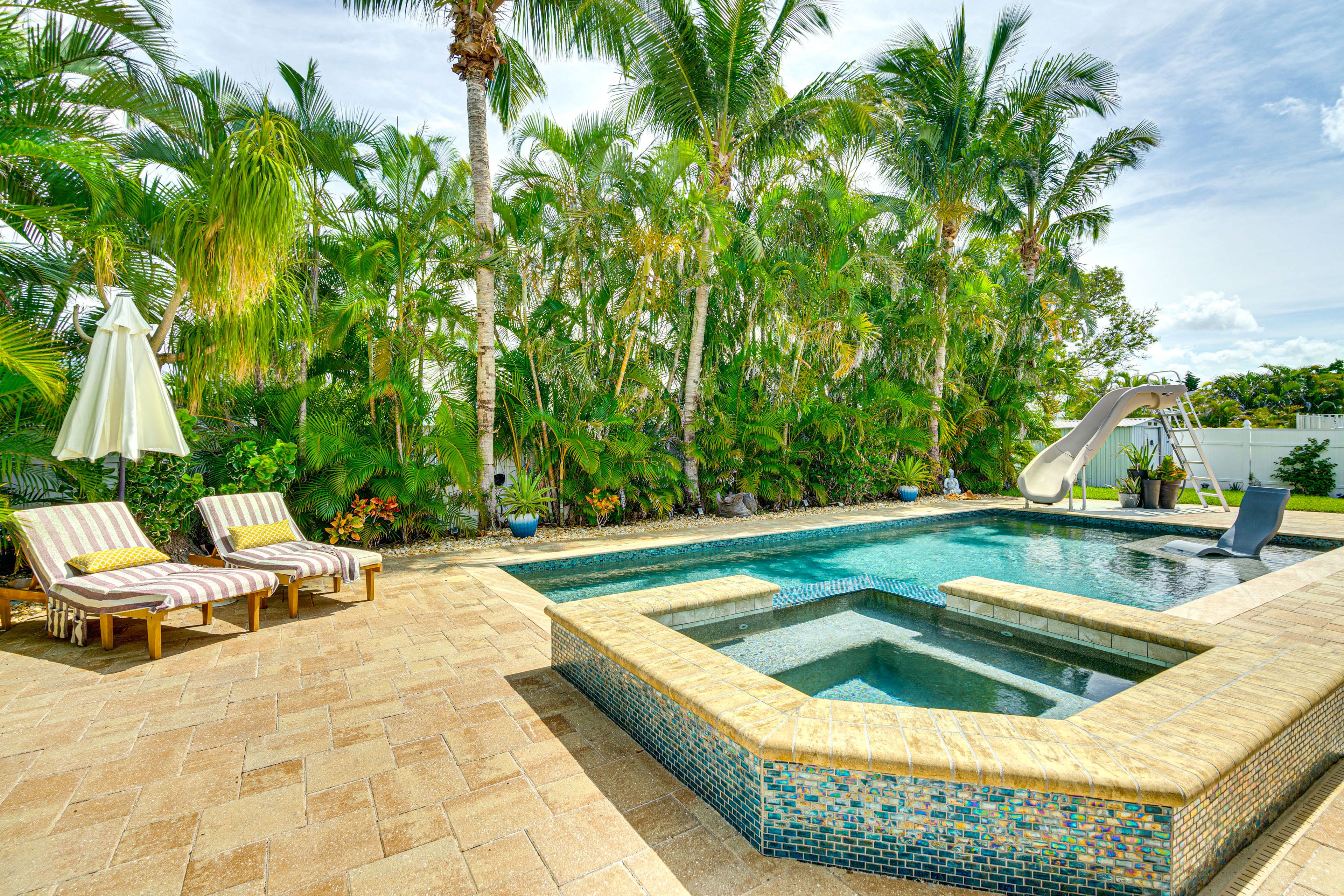 Fenced-In Yard | Private Pool w/ Spa & Slide | Lounging Furniture