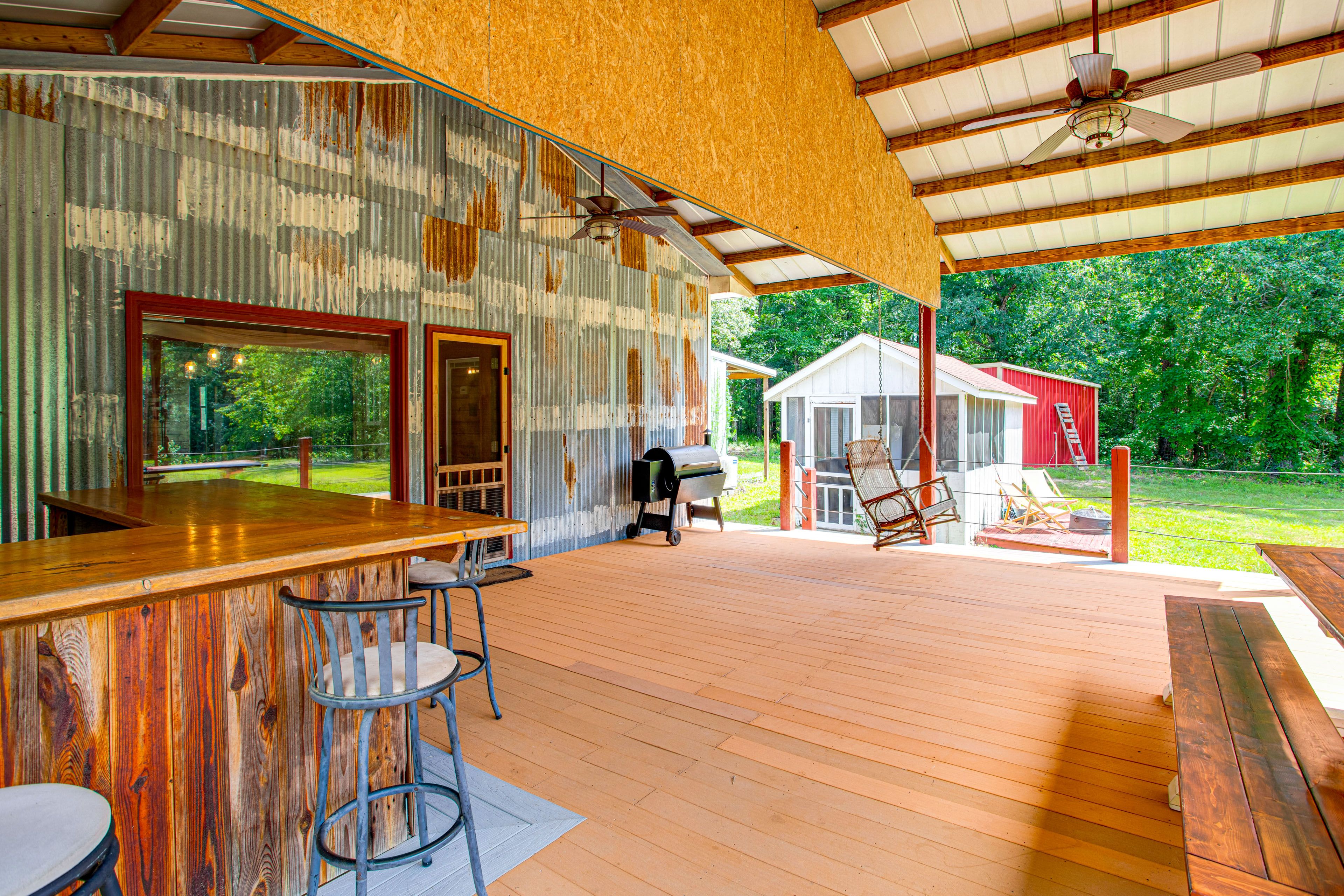 Cabin Exterior | Covered Deck | Wet Bar | Dining Area | Charcoal Grill