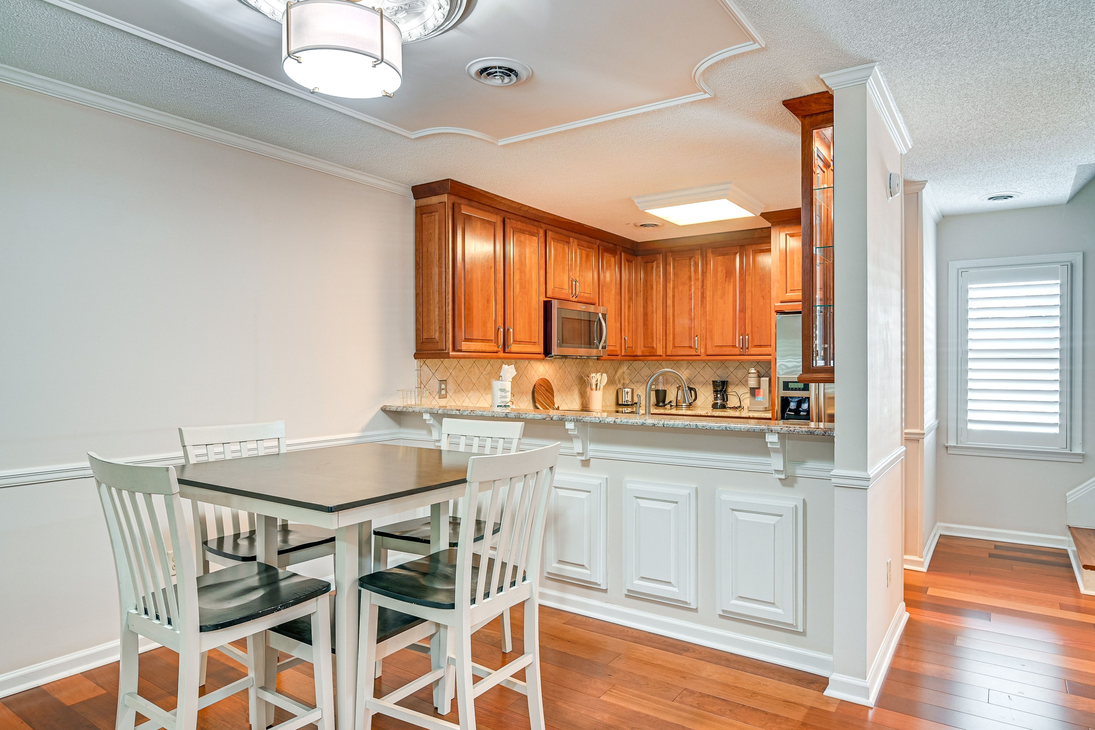 Dining Area | Dishware & Flatware | 2-Story Condo | 1st Floor
