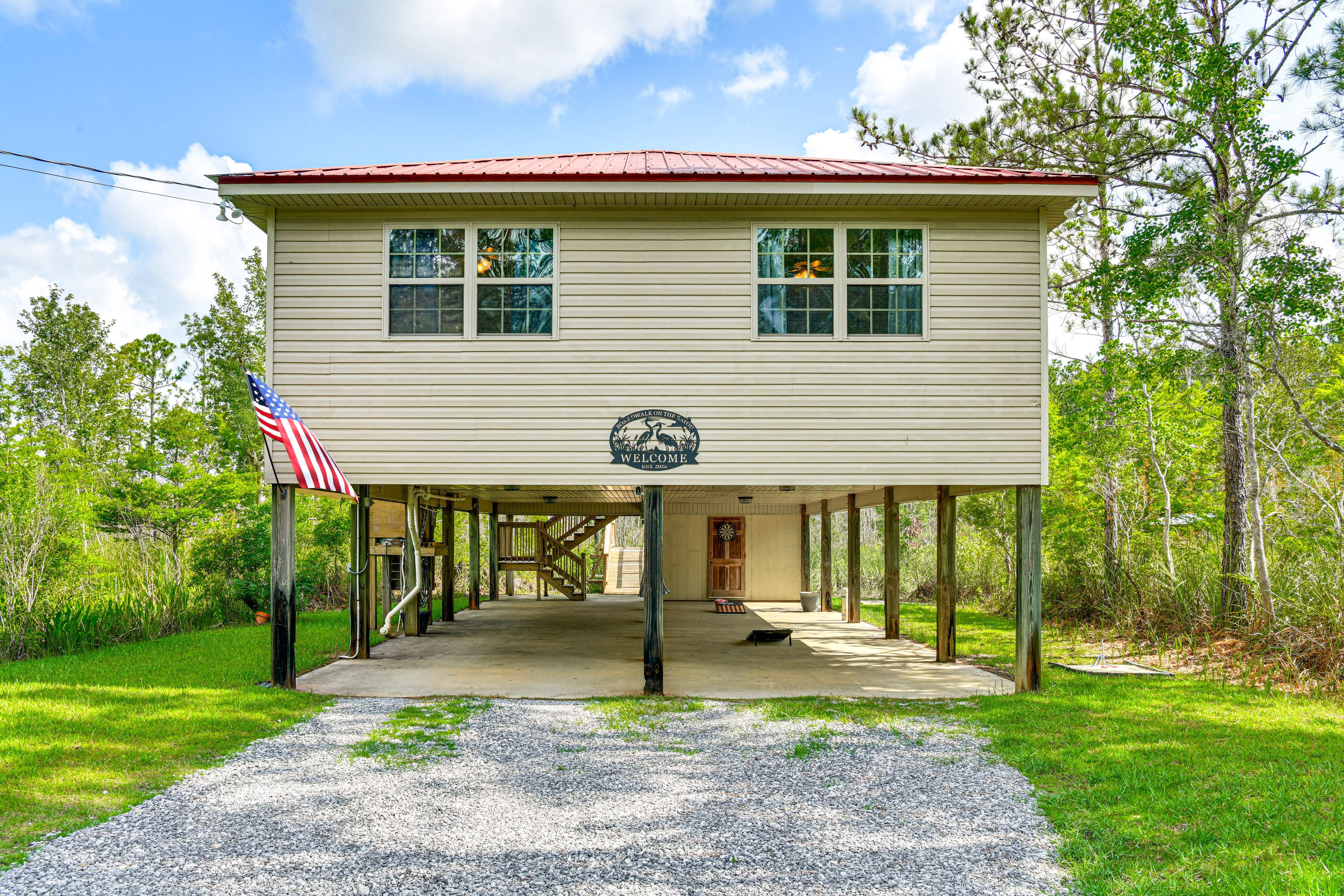 Property Exterior | Stilted Single-Story Home | Canal Access On-Site