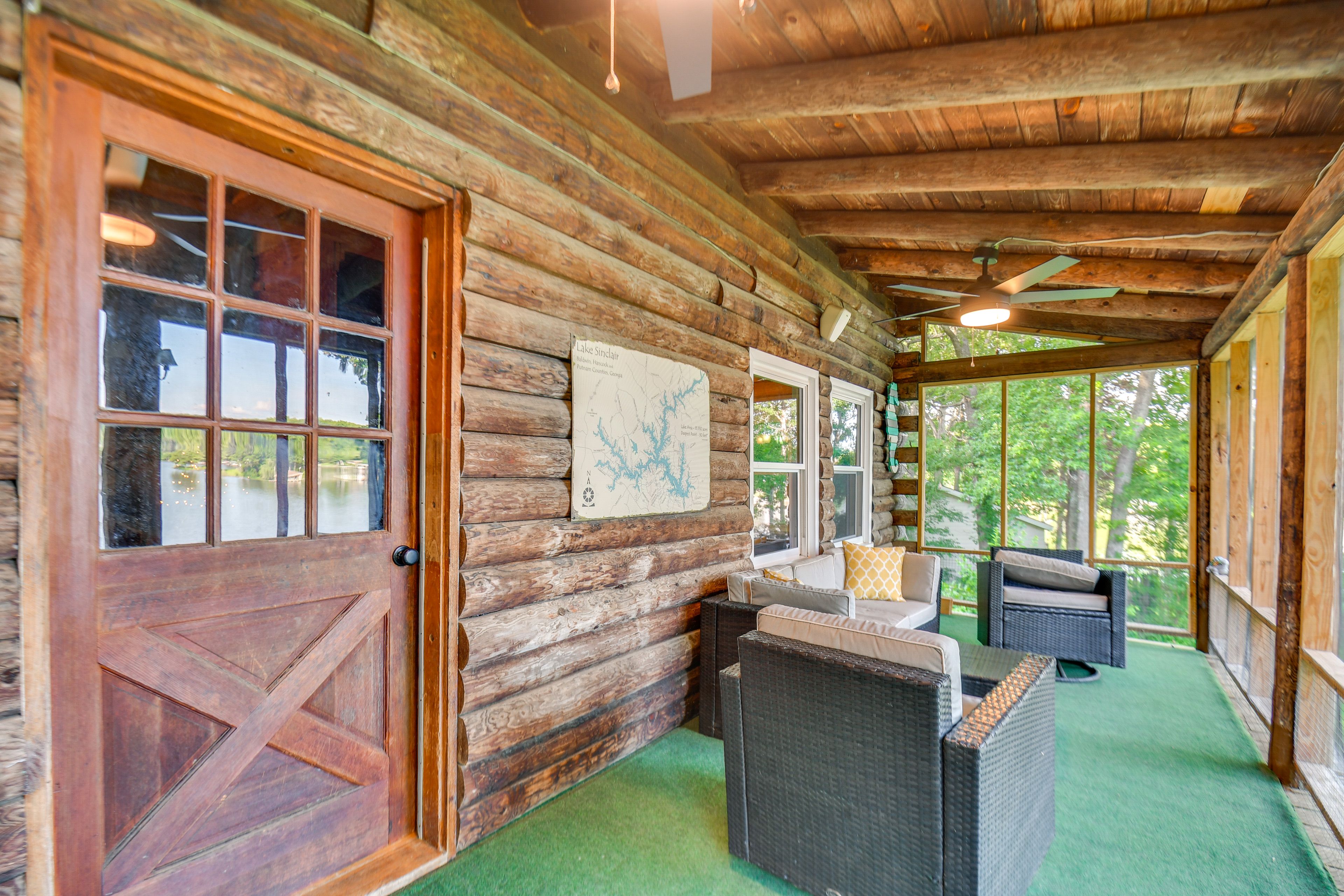Cabin Exterior | Screened Deck w/ Seating | Lake Views
