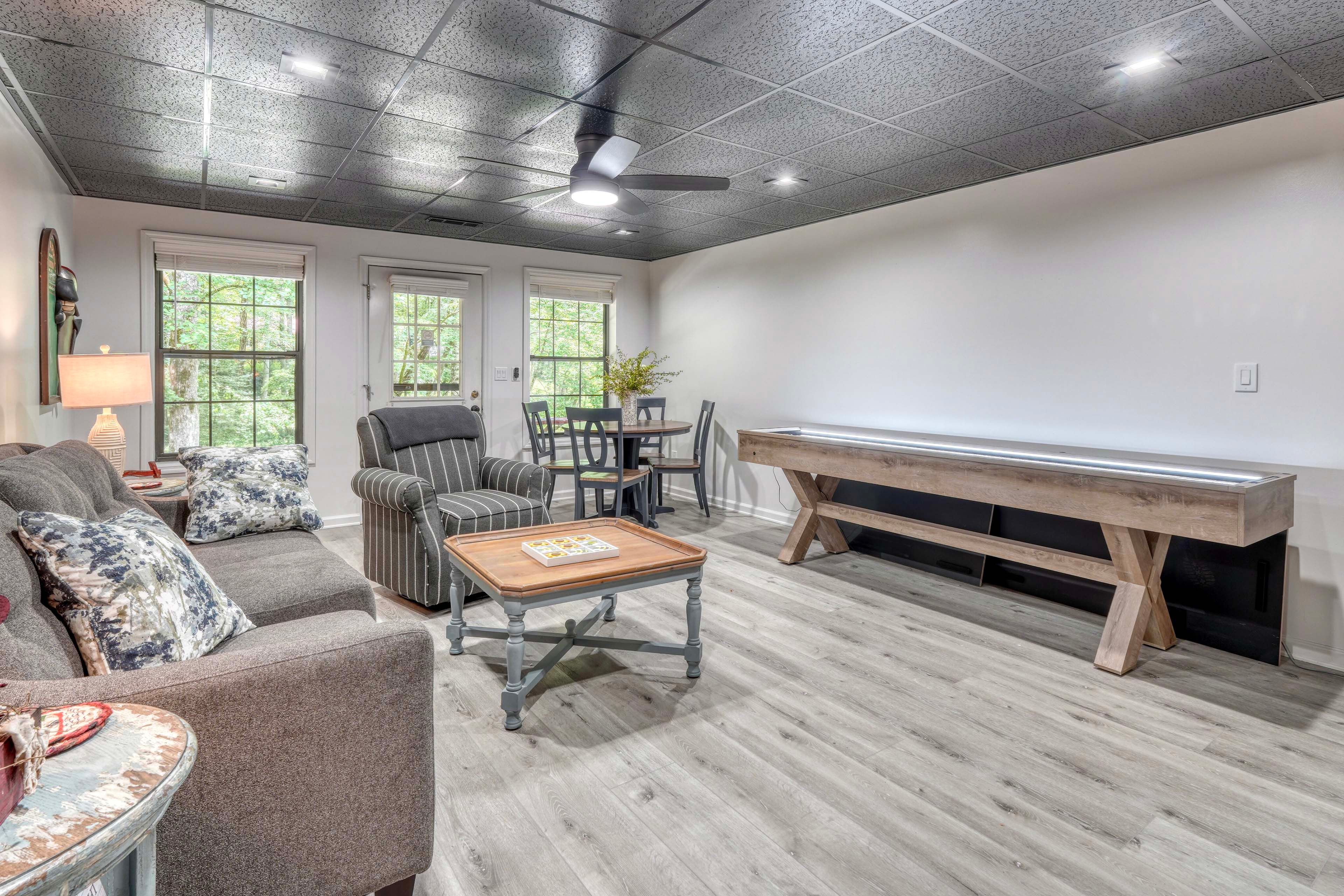 Basement Living Area | Smart TV | Dining Table | Fireplace | Shuffleboard