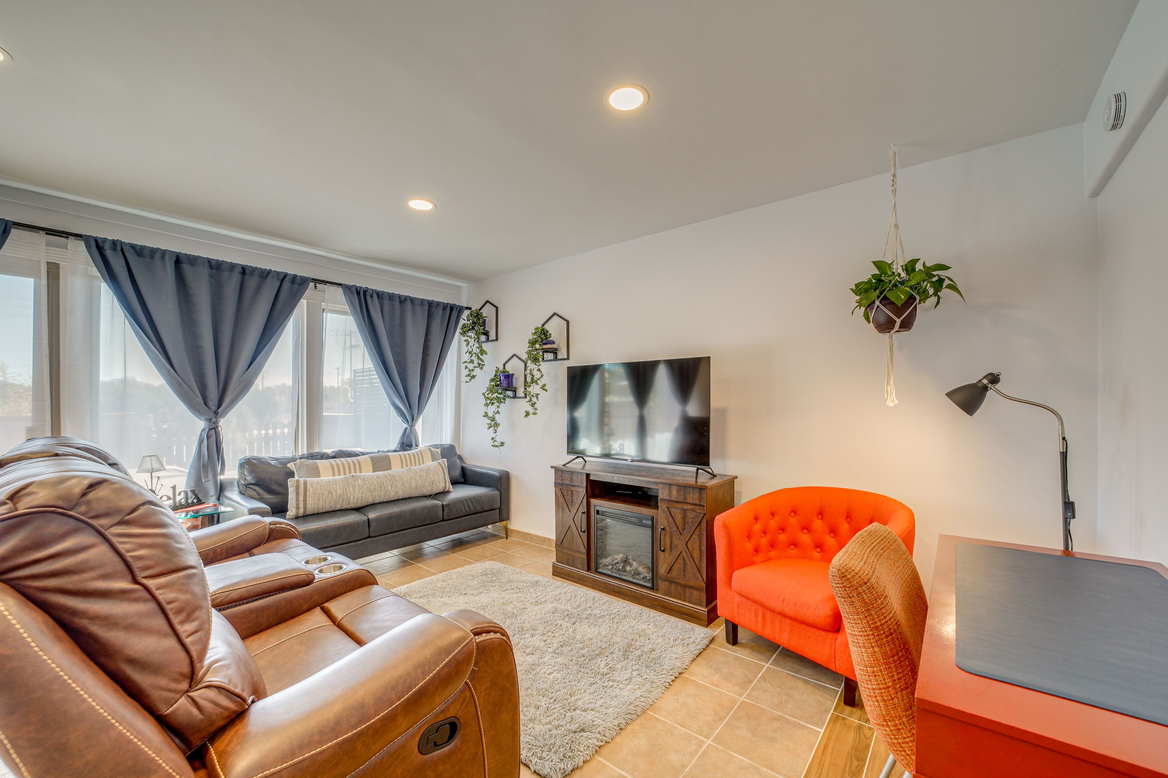 Dual reclining & rocking loveseat w/ electric fireplace for ultimate comfort