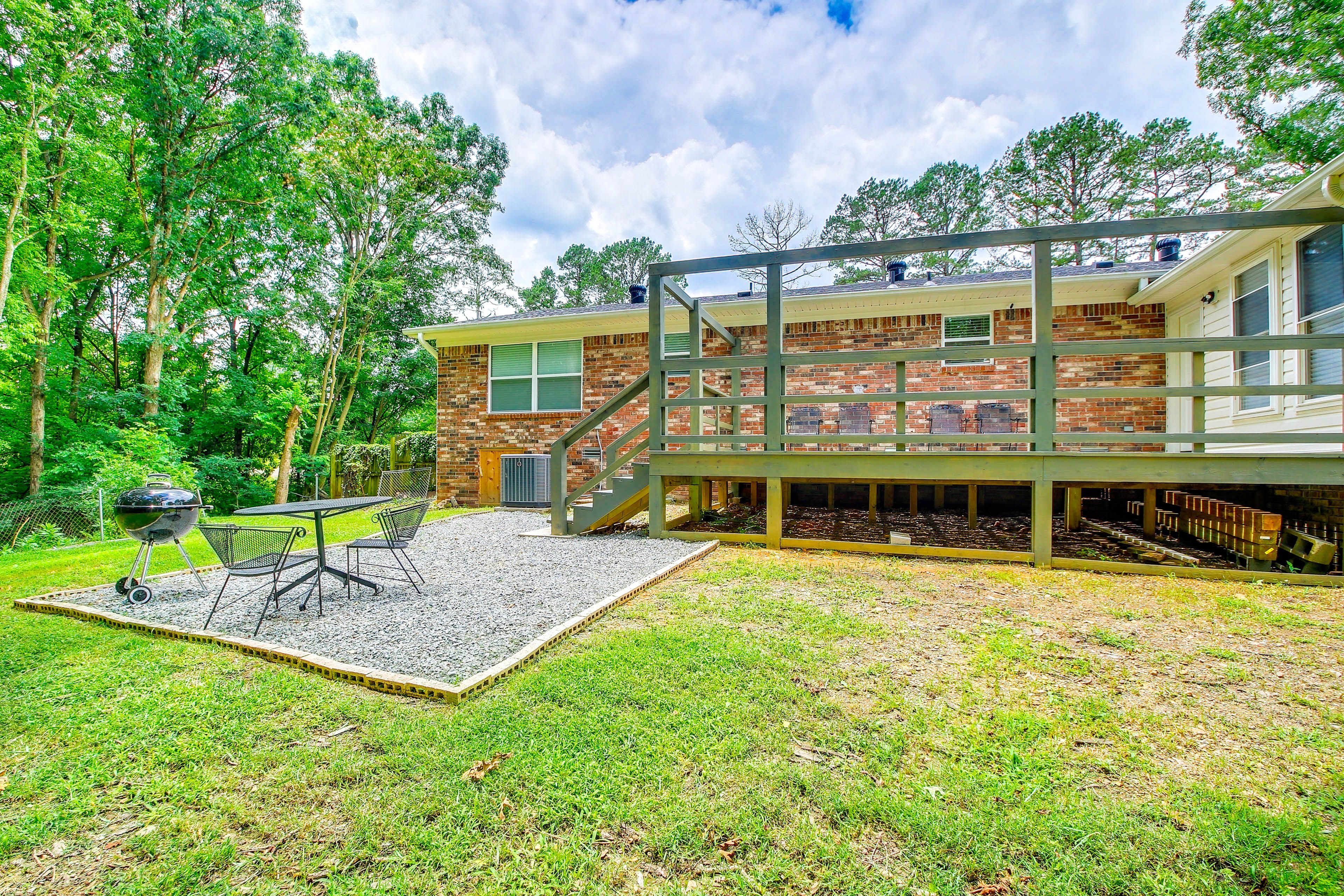 Partially Fenced Backyard | Dining Area | Charcoal Grill