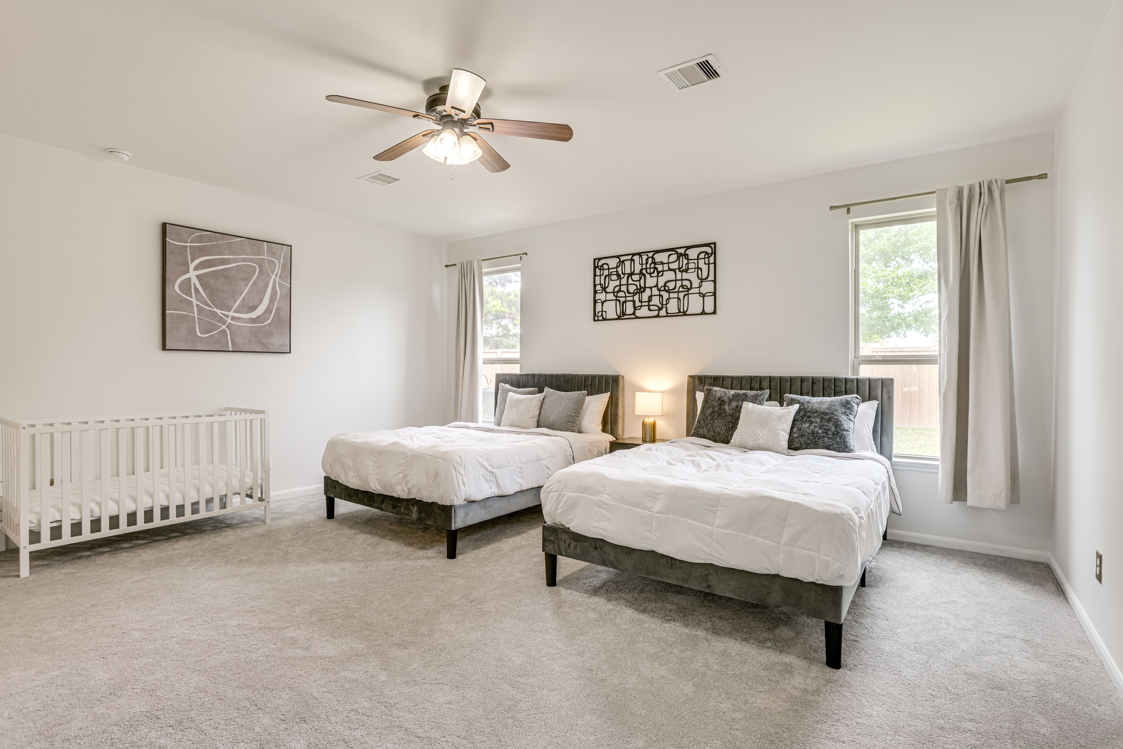 Bedroom 1 | 2 Queen Beds | Crib | Smart TV