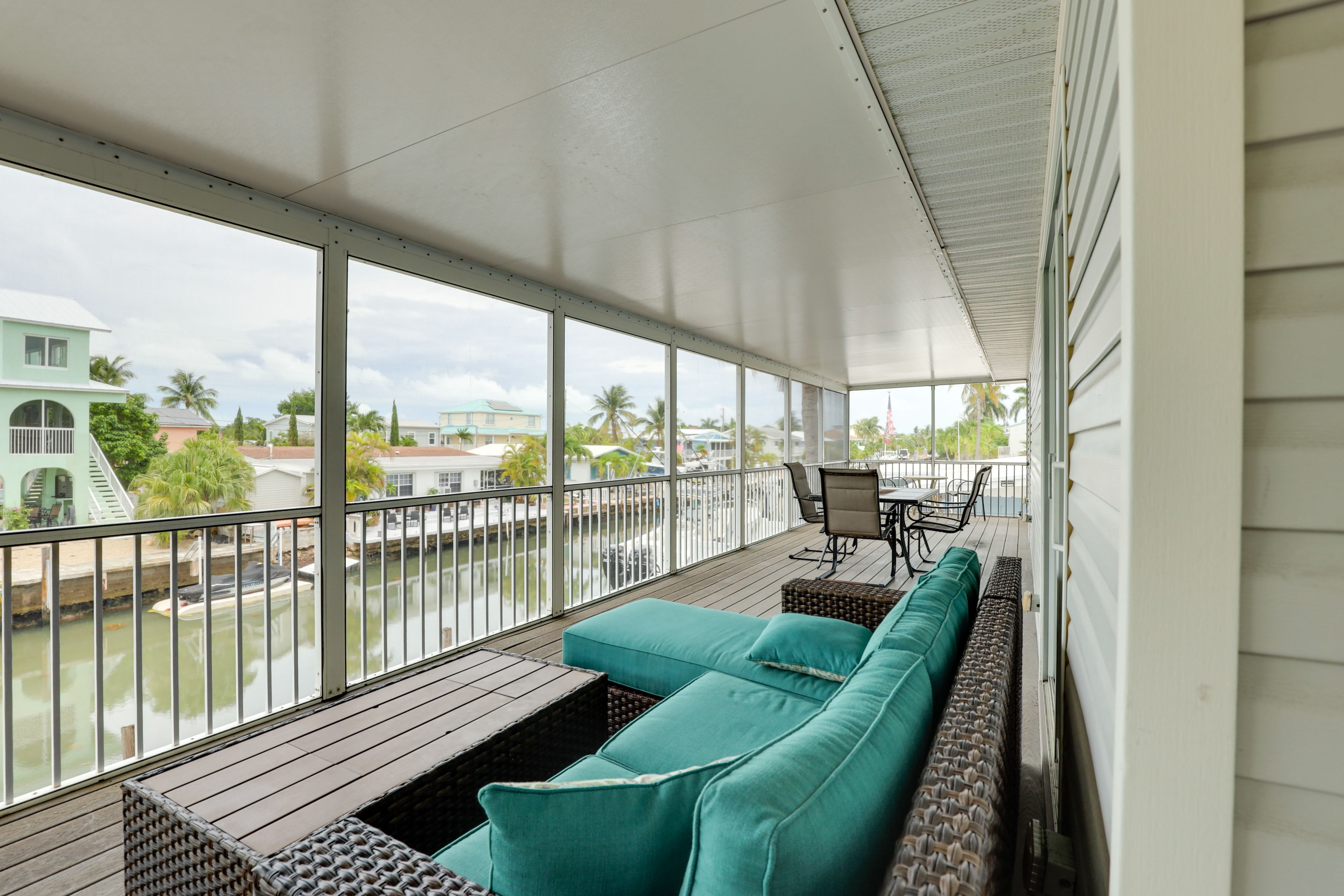 Screened Porch | Outdoor Seating | Canal Views