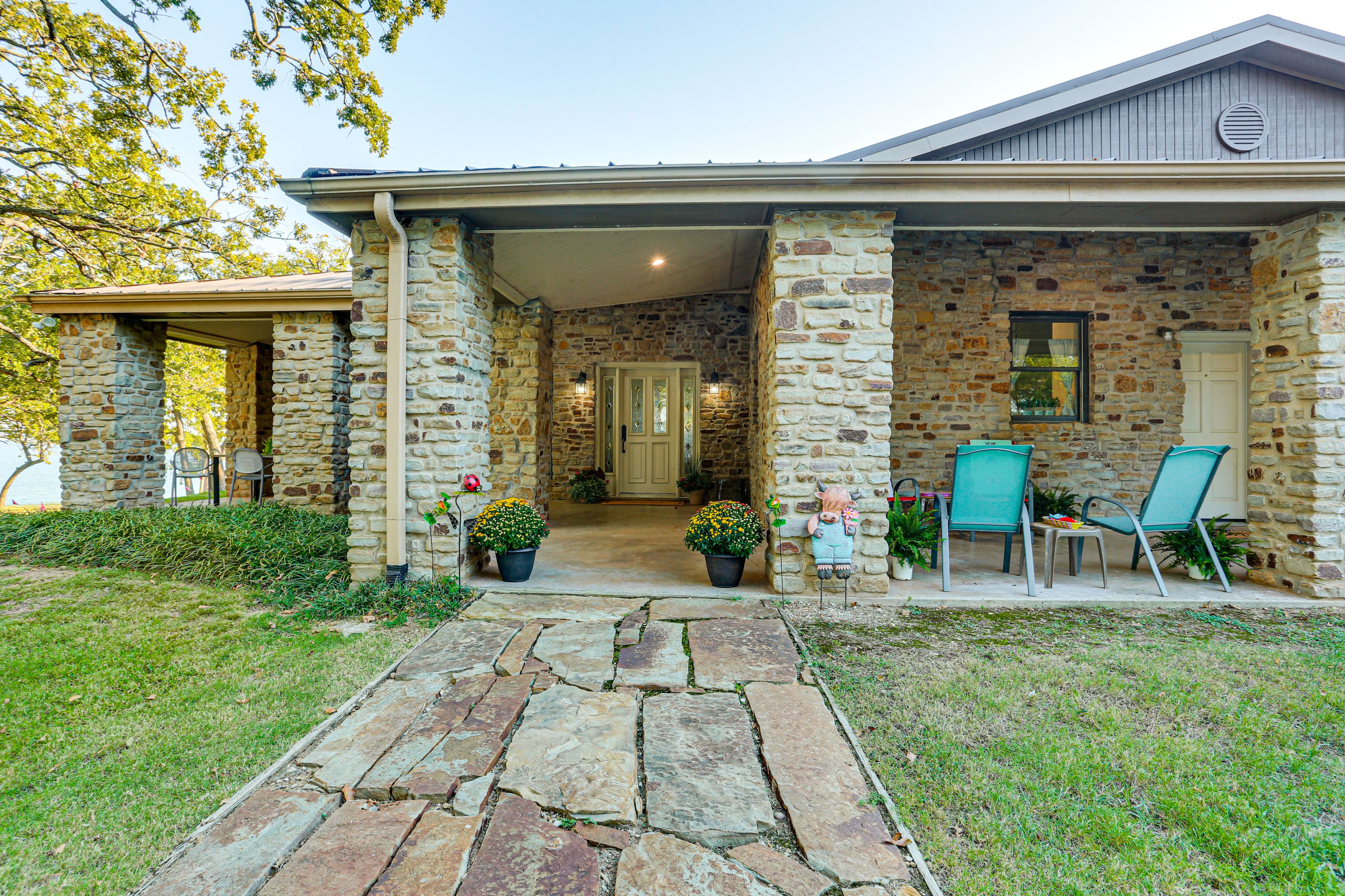 Property Exterior | Covered Patio w/ Seating | Gas Grill