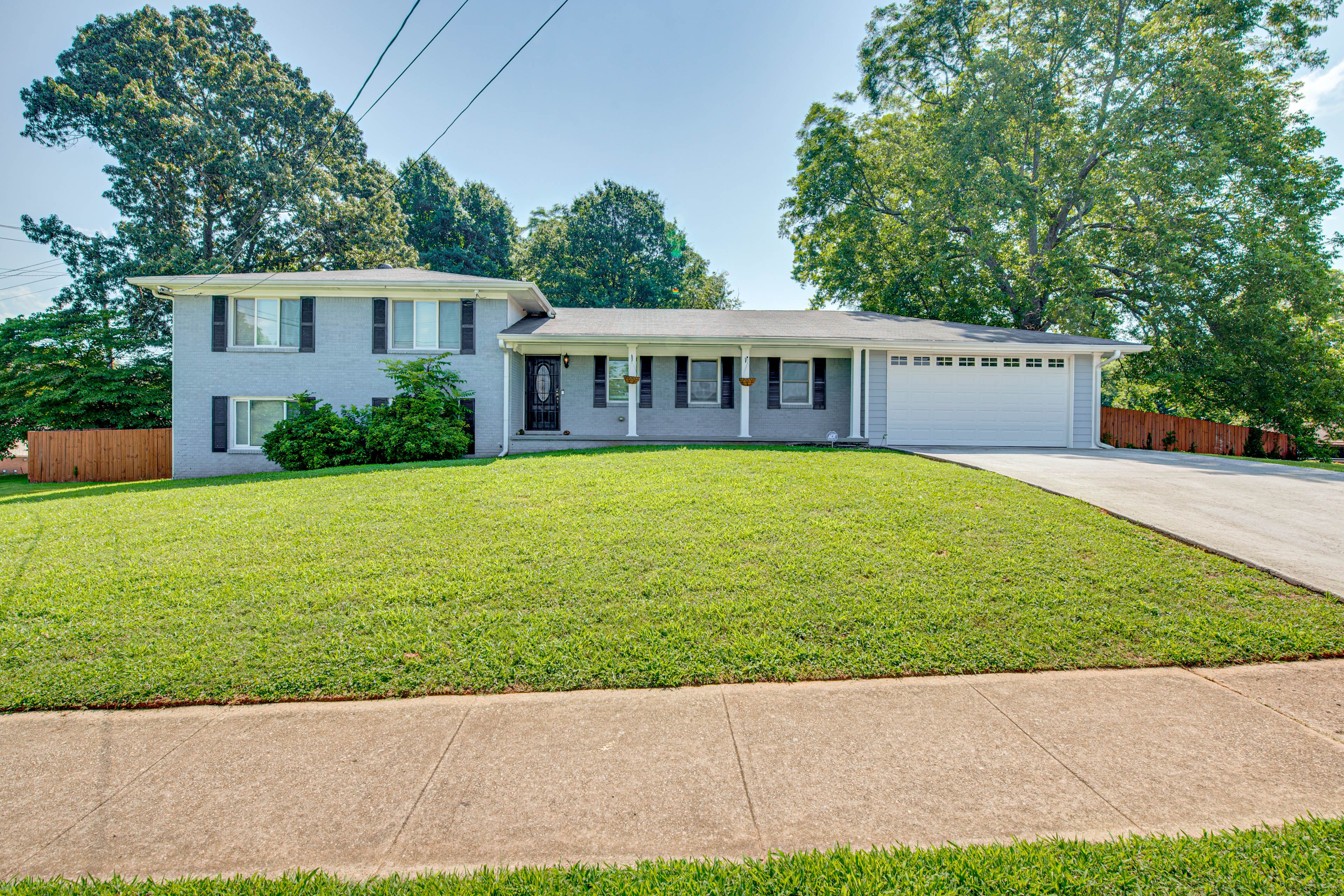 Exterior | Garden-Level Apt | Shared Driveway (1 Vehicle) | Street Parking