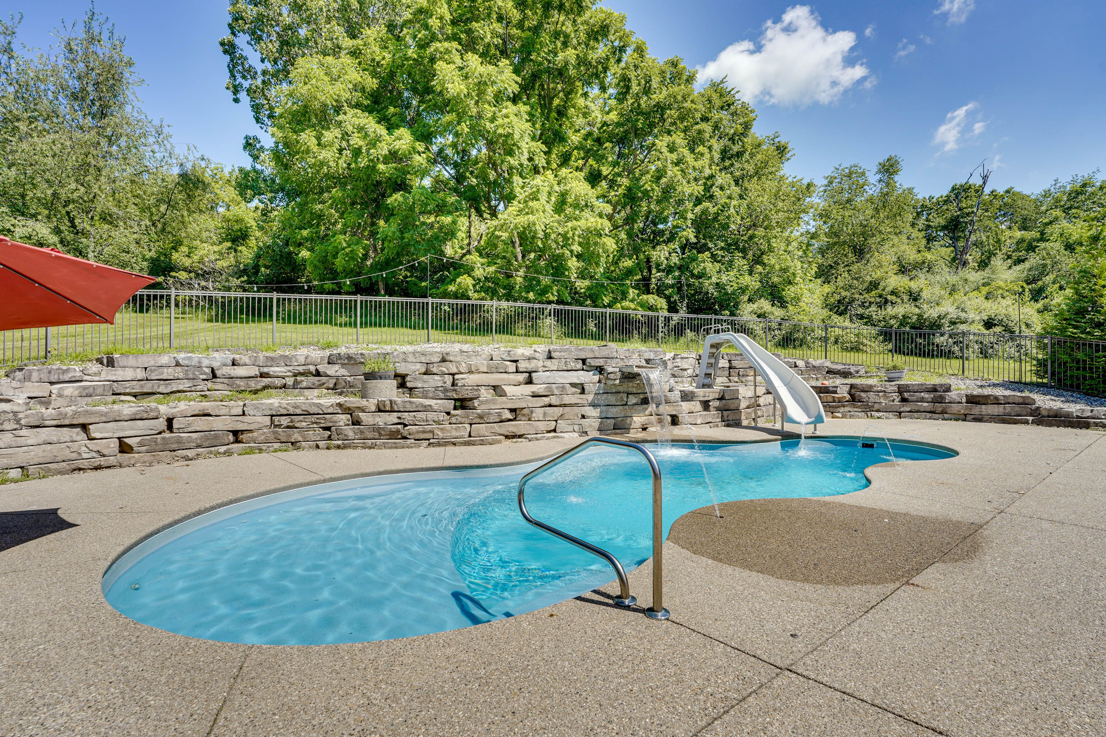 House Exterior | Heated Pool w/ Waterslide & Waterfall
