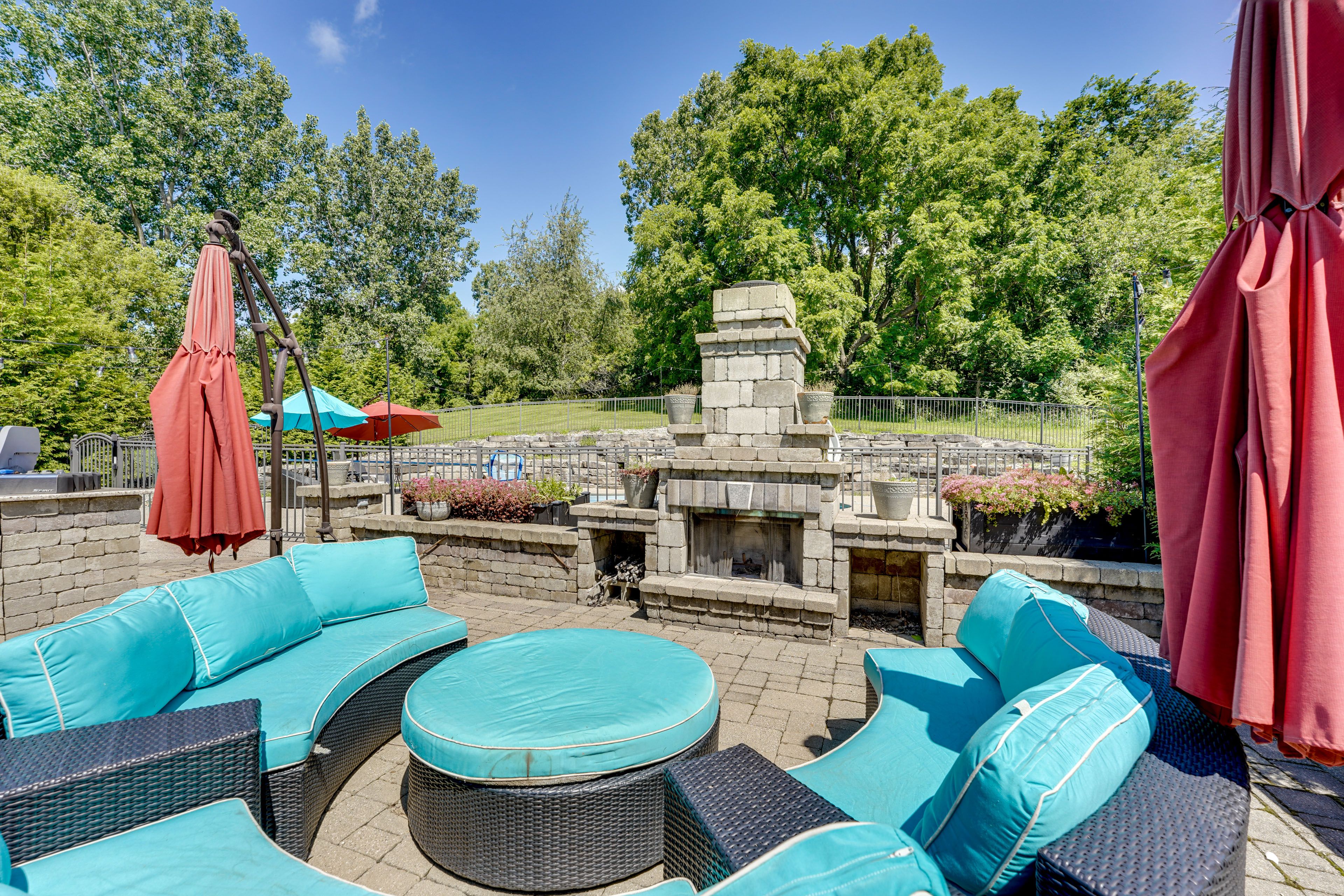House Exterior | Furnished Patio | Gas Fireplace | Dining Areas w/ Umbrellas