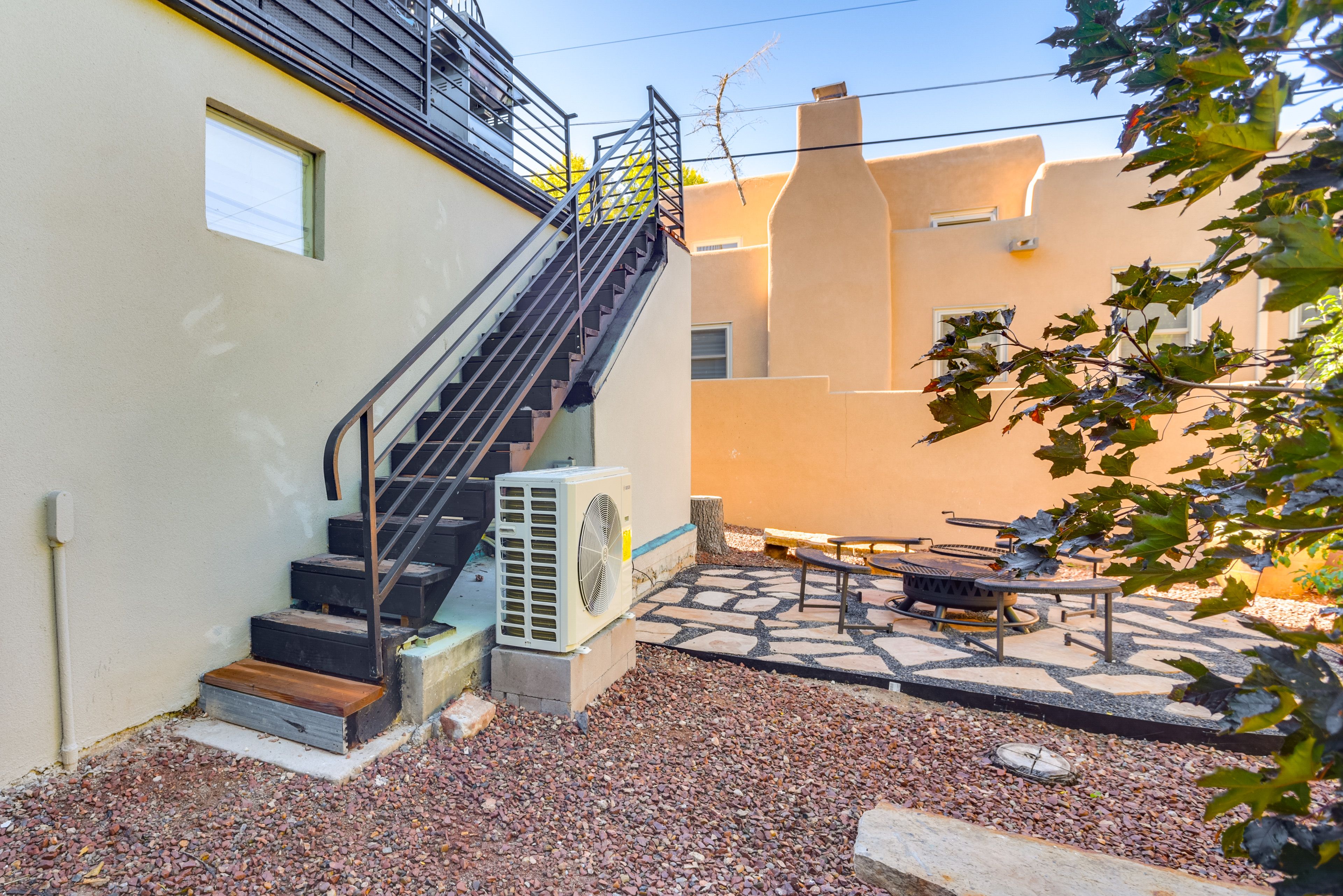 Condo Exterior | Patio w/ Fire Pit | Private Hot Tub | Fenced Yard Area
