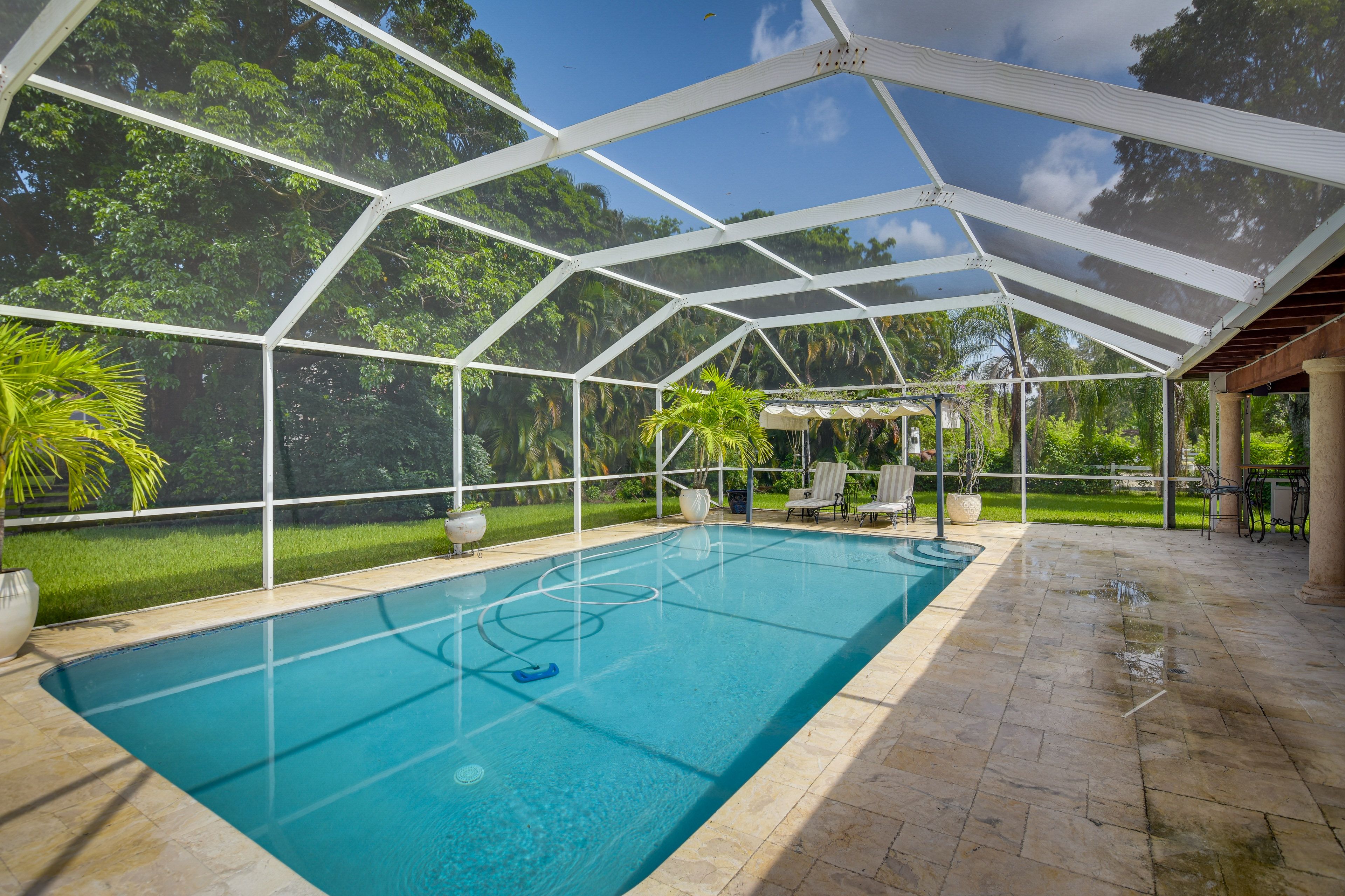 Private Screened-In Lanai | Outdoor Pool | Lounge Chairs