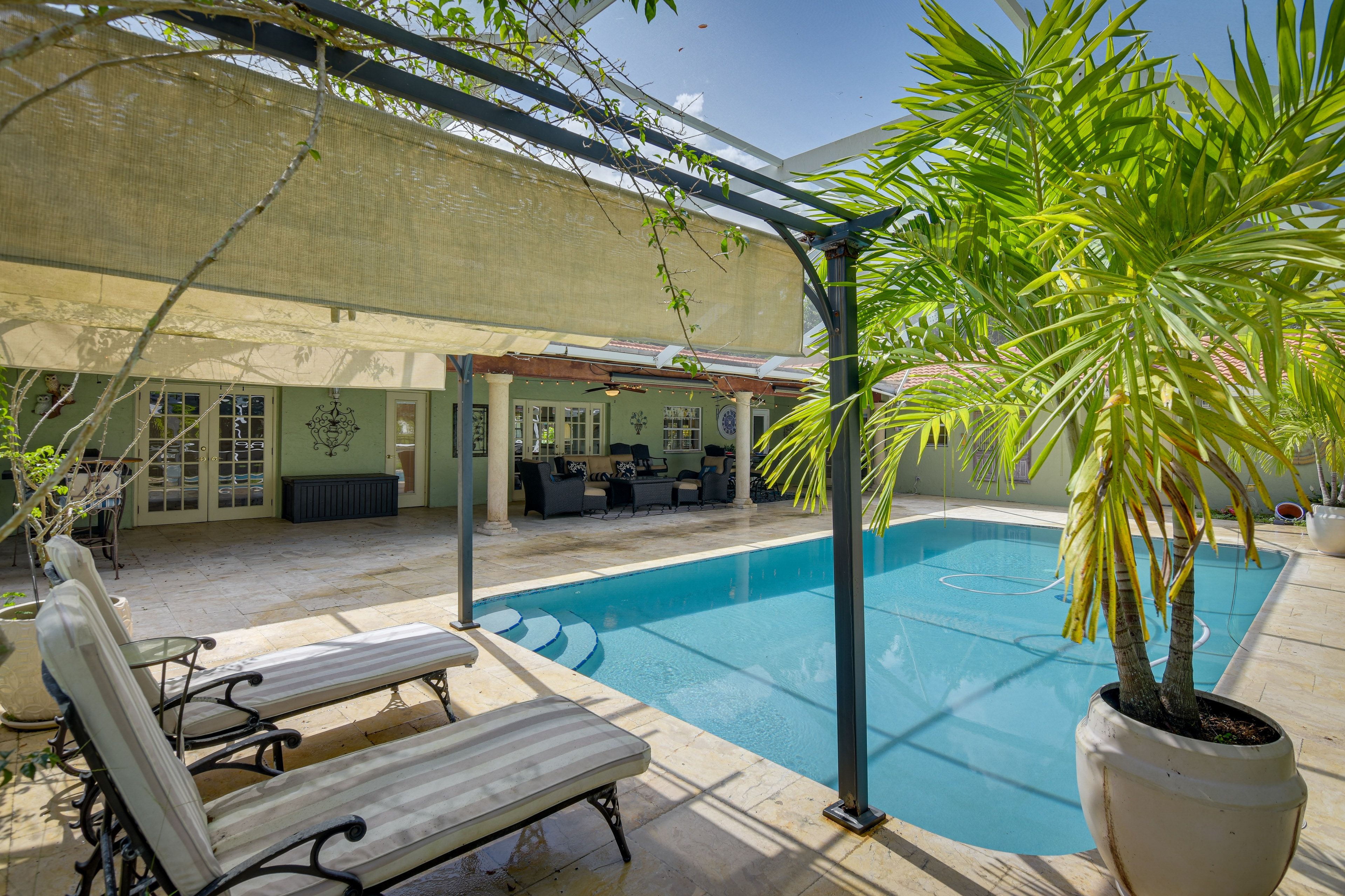 Private Screened-In Lanai | Outdoor Pool | Lounge Chairs