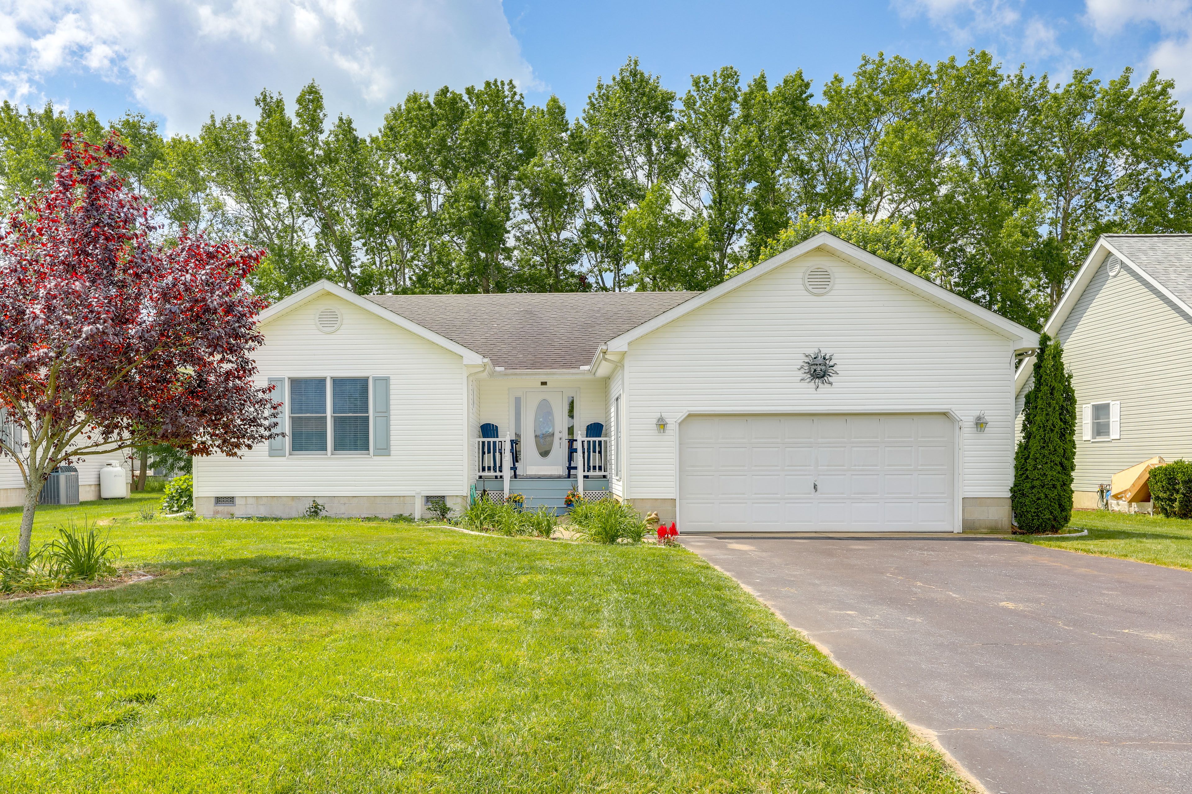 Property Exterior | Single-Story Home | Furnished Deck | Grassy Yard