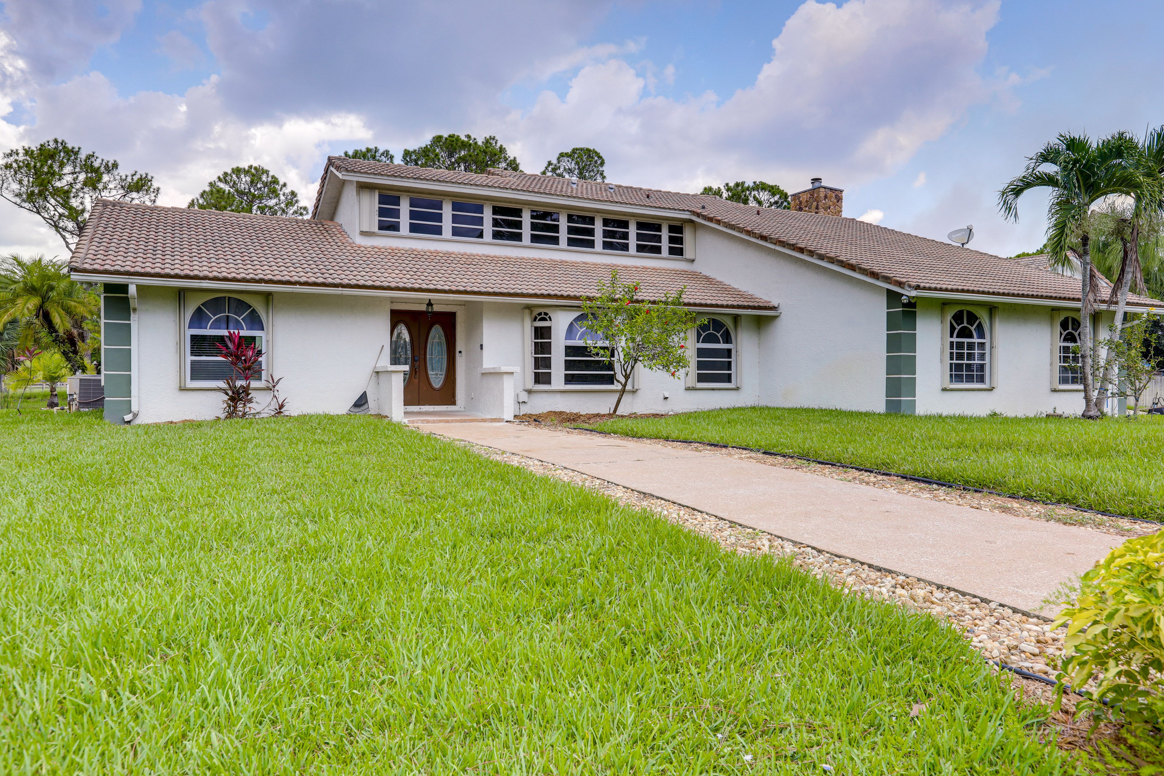 Exterior | 2-Story House | 11 Mi to Royal Palm Beach Restaurants & Shops