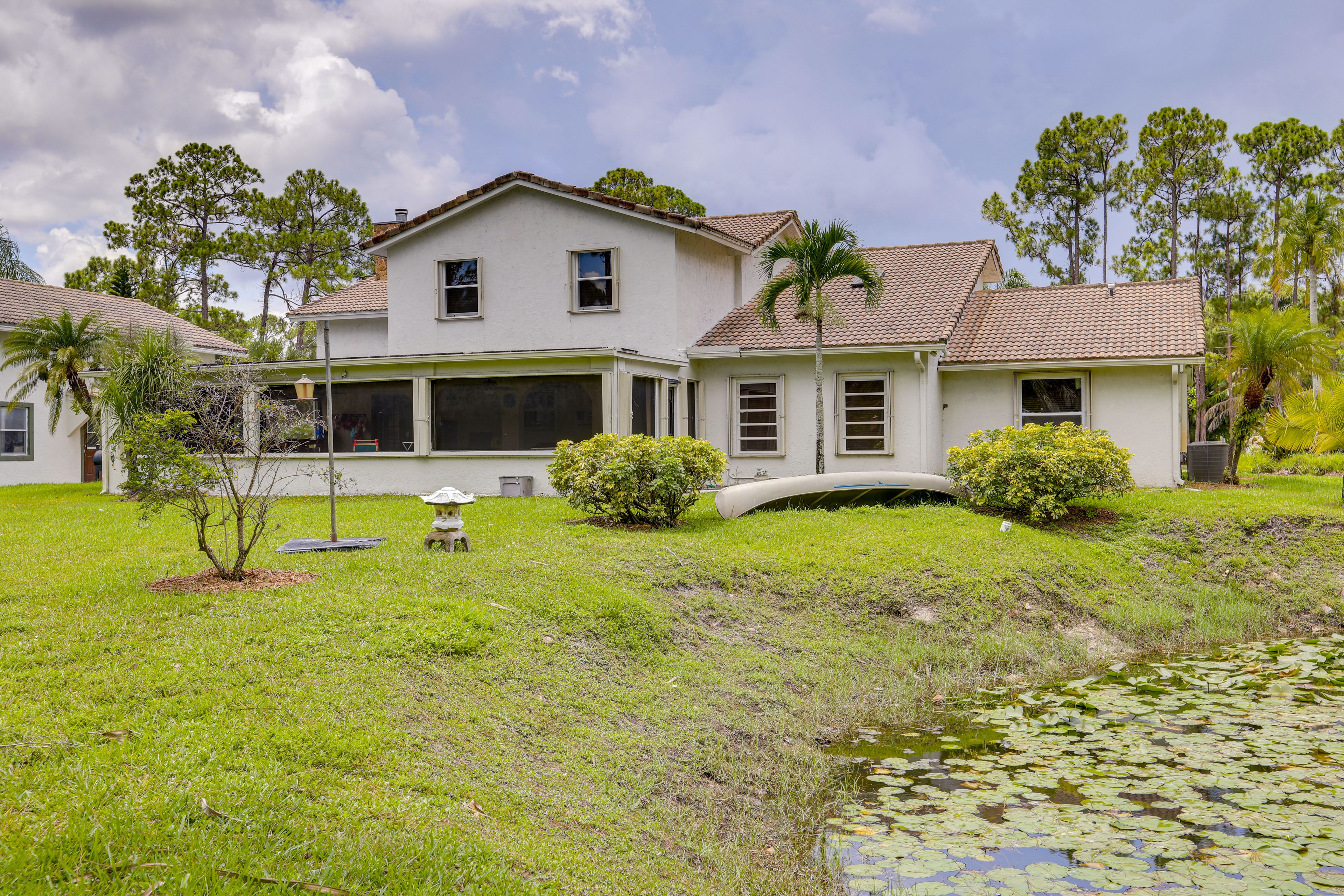 Backyard | Pond w/ Canoe | 17 Mi to Riviera Beach Access