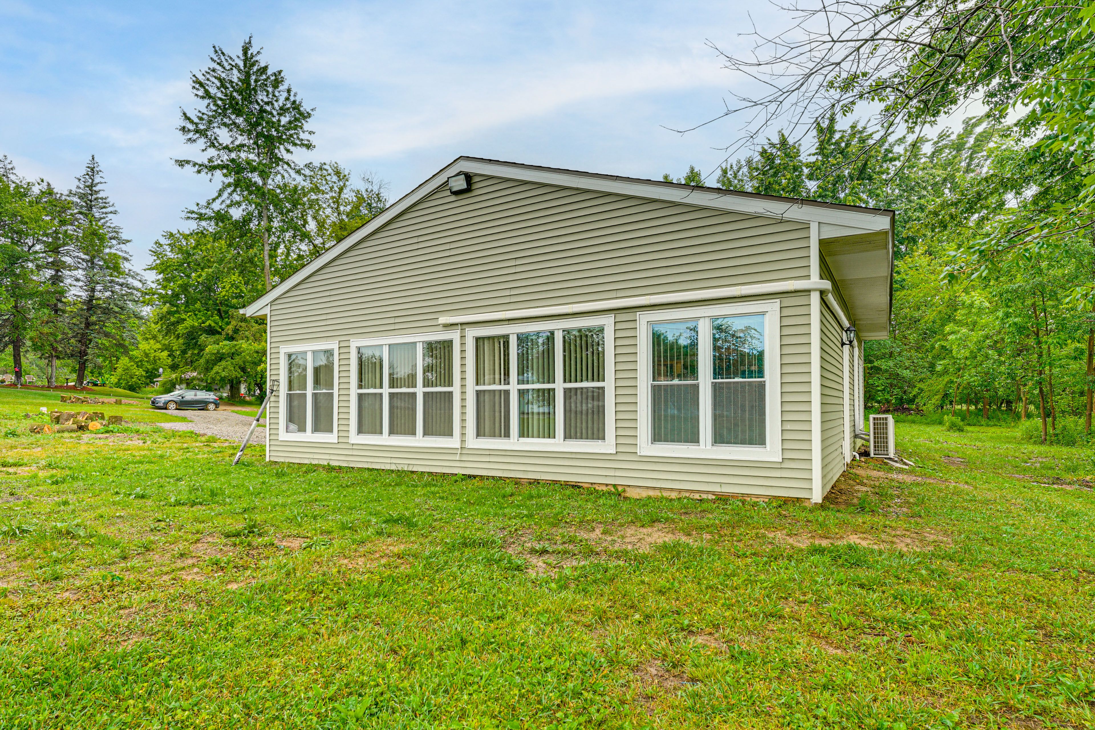 Property Exterior | Spacious Yard | Lake Views | Single-Story Home