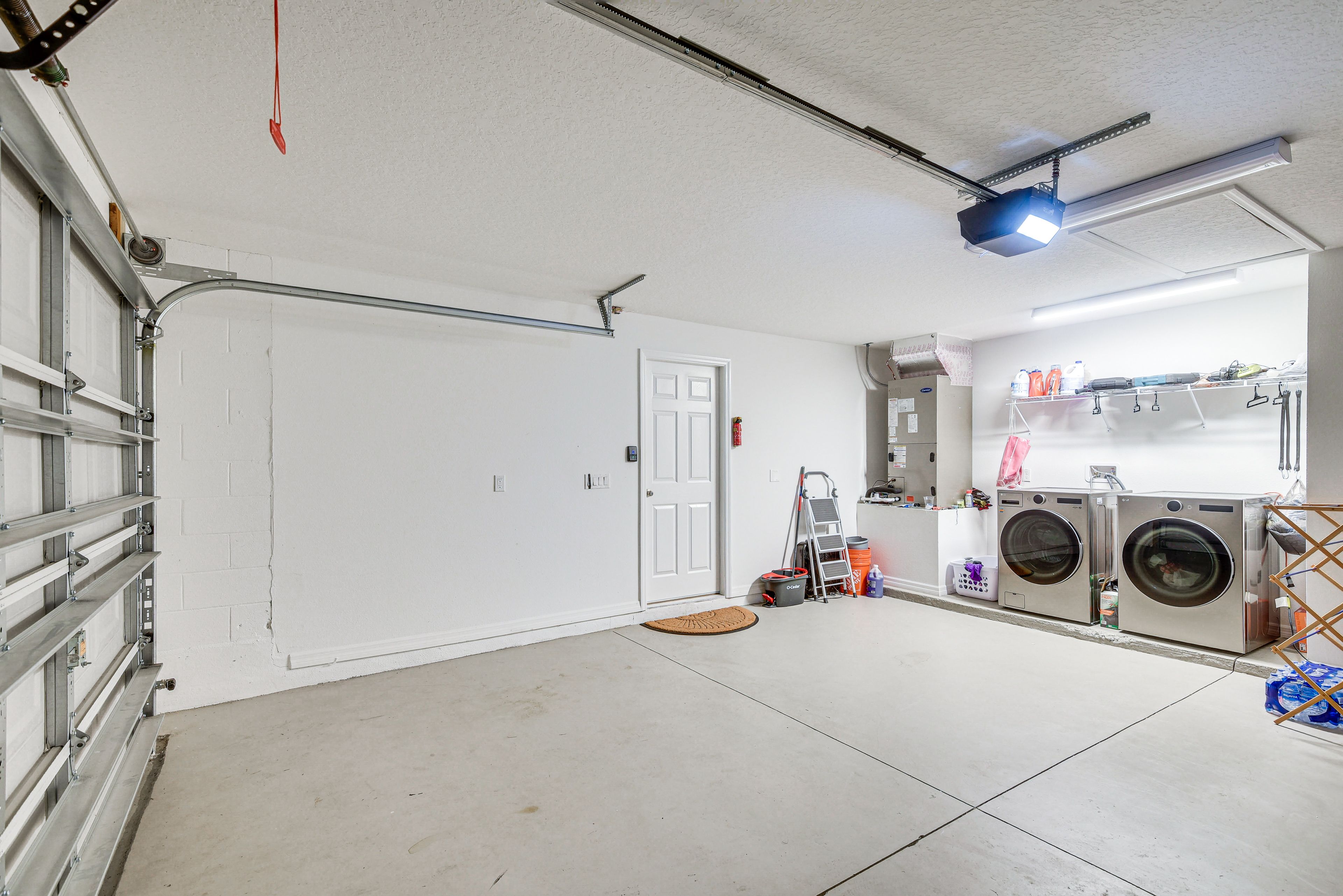 Garage Interior | In-Unit Laundry | Detergent | Iron & Board