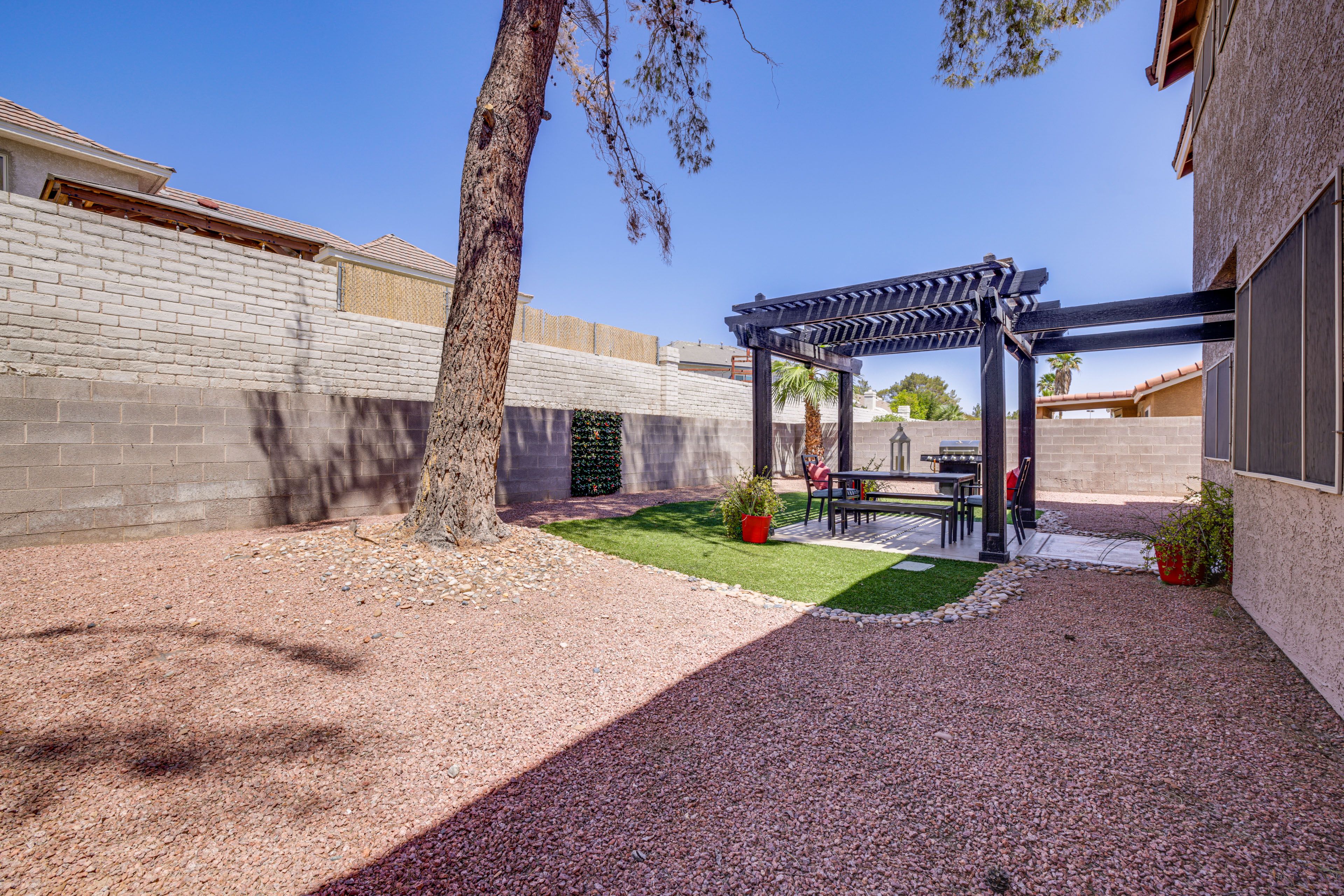 House Exterior | Patio w/ Pergola | Dining Area | Gas Grill | Fenced Backyard