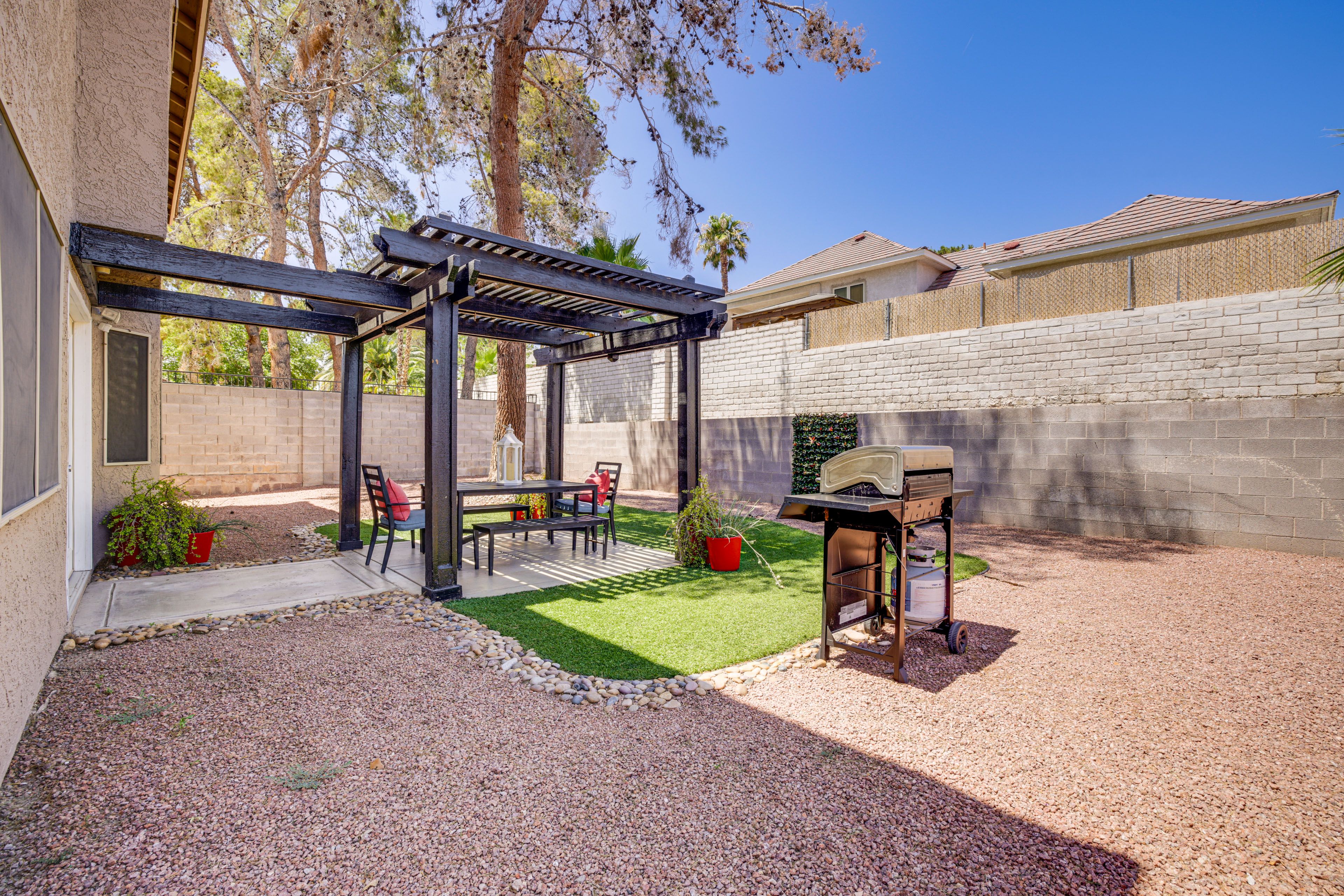 House Exterior | Patio w/ Pergola | Dining Area | Gas Grill | Fenced Backyard