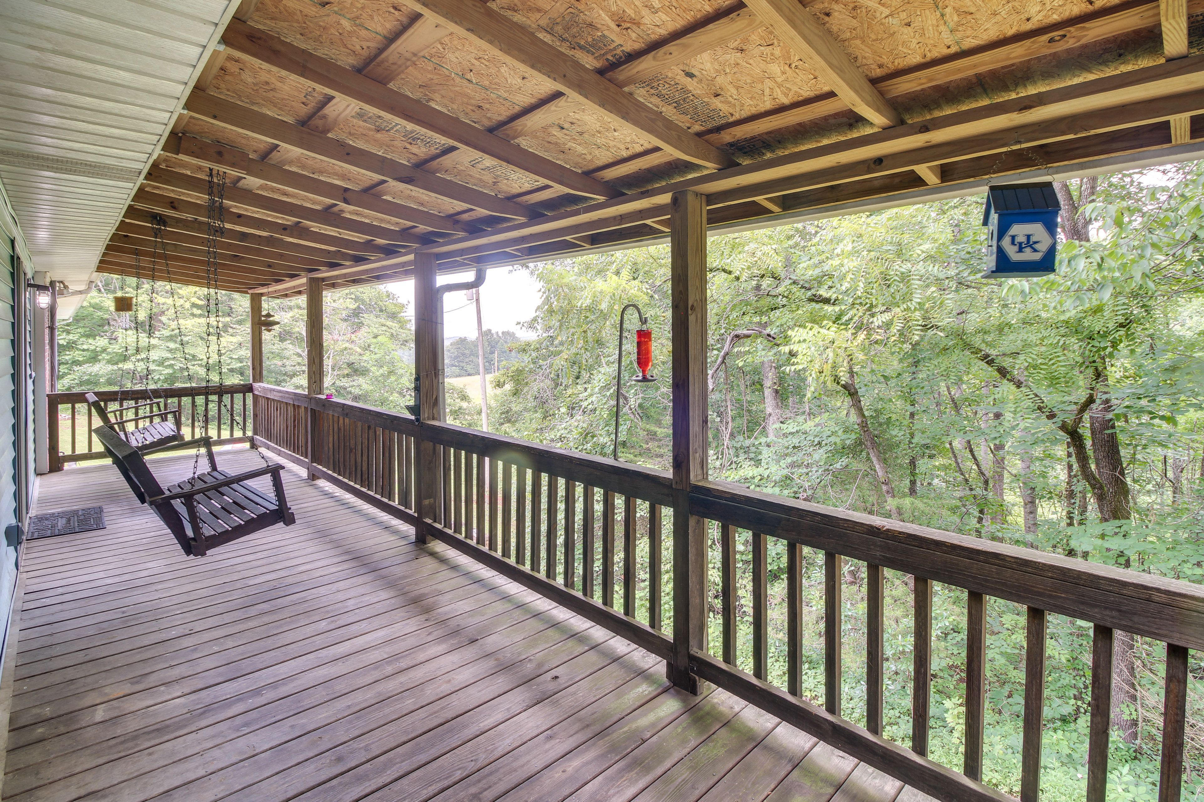 Covered Porch w/ Bench Swings | Serene Forested Views