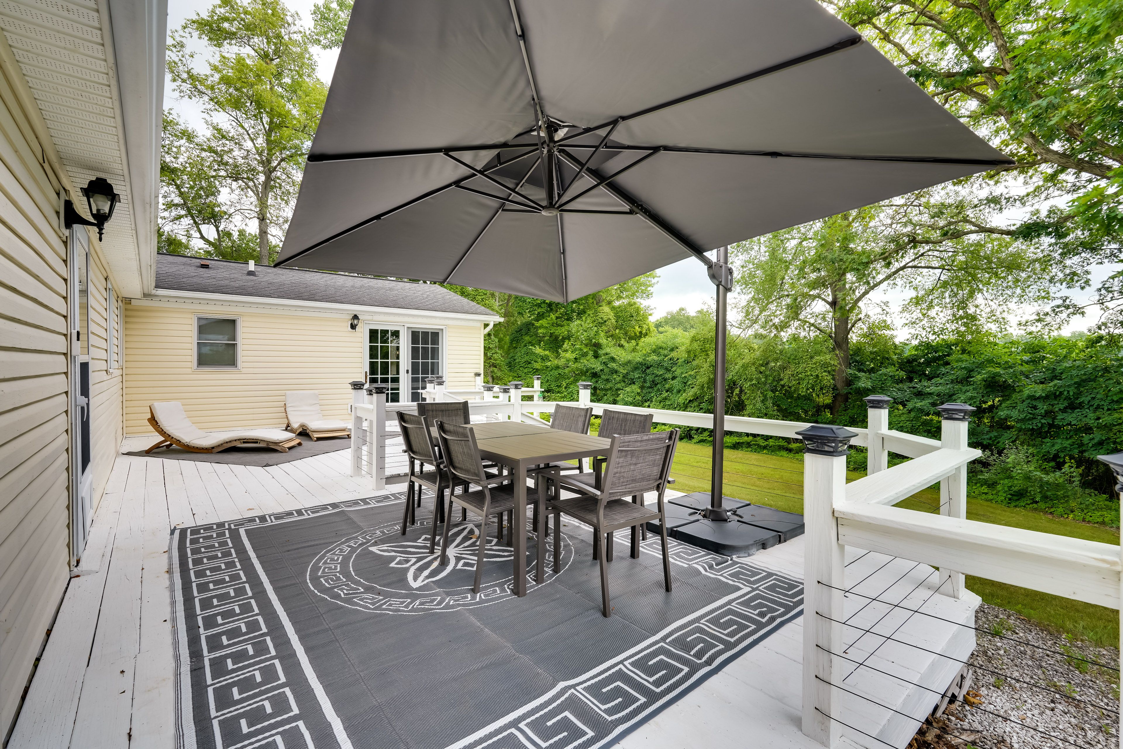 House Exterior | Furnished Deck | Dining Area w/ Umbrella