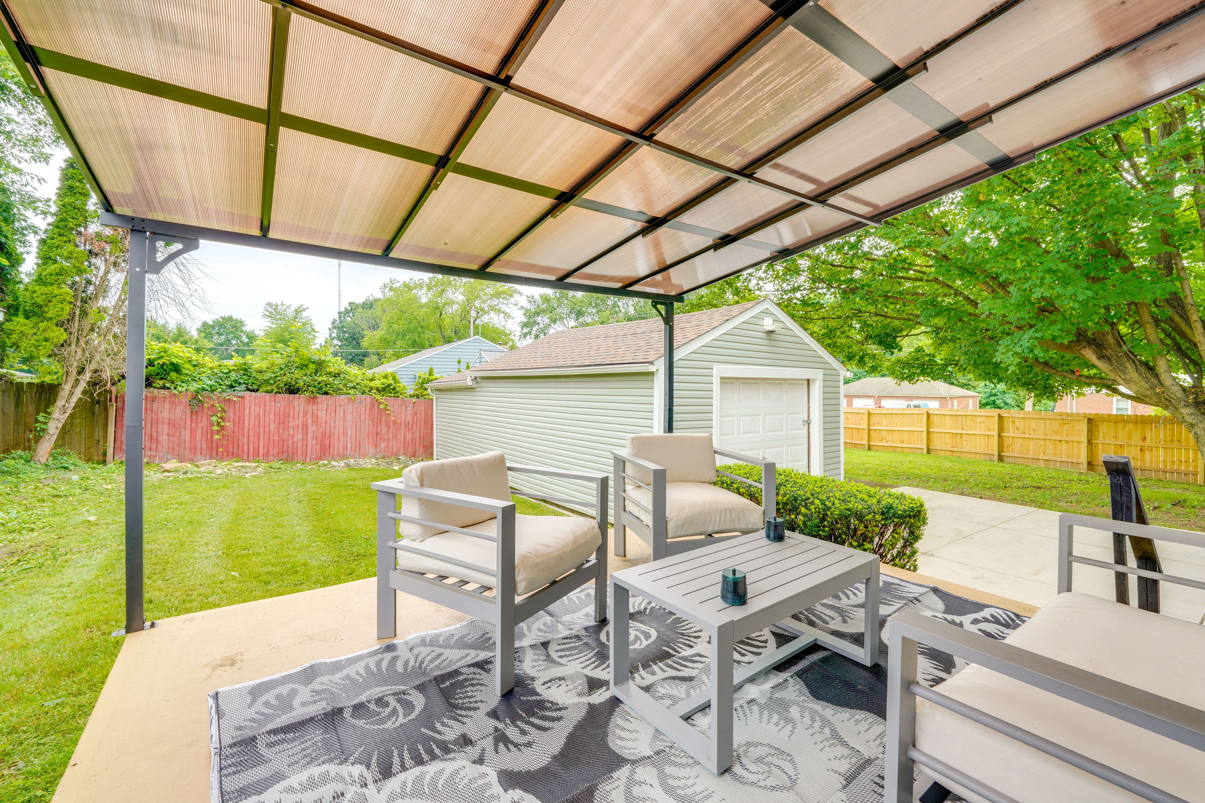 Covered Patio | Outdoor Seating | Partially Fenced Backyard