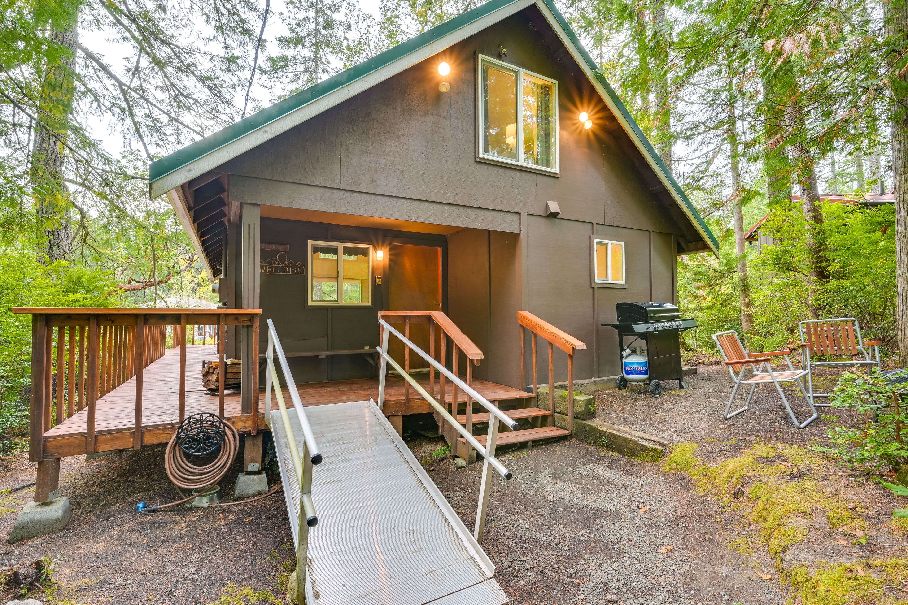 Studio Exterior | Gas Grill | Gravel Area w/ Seating