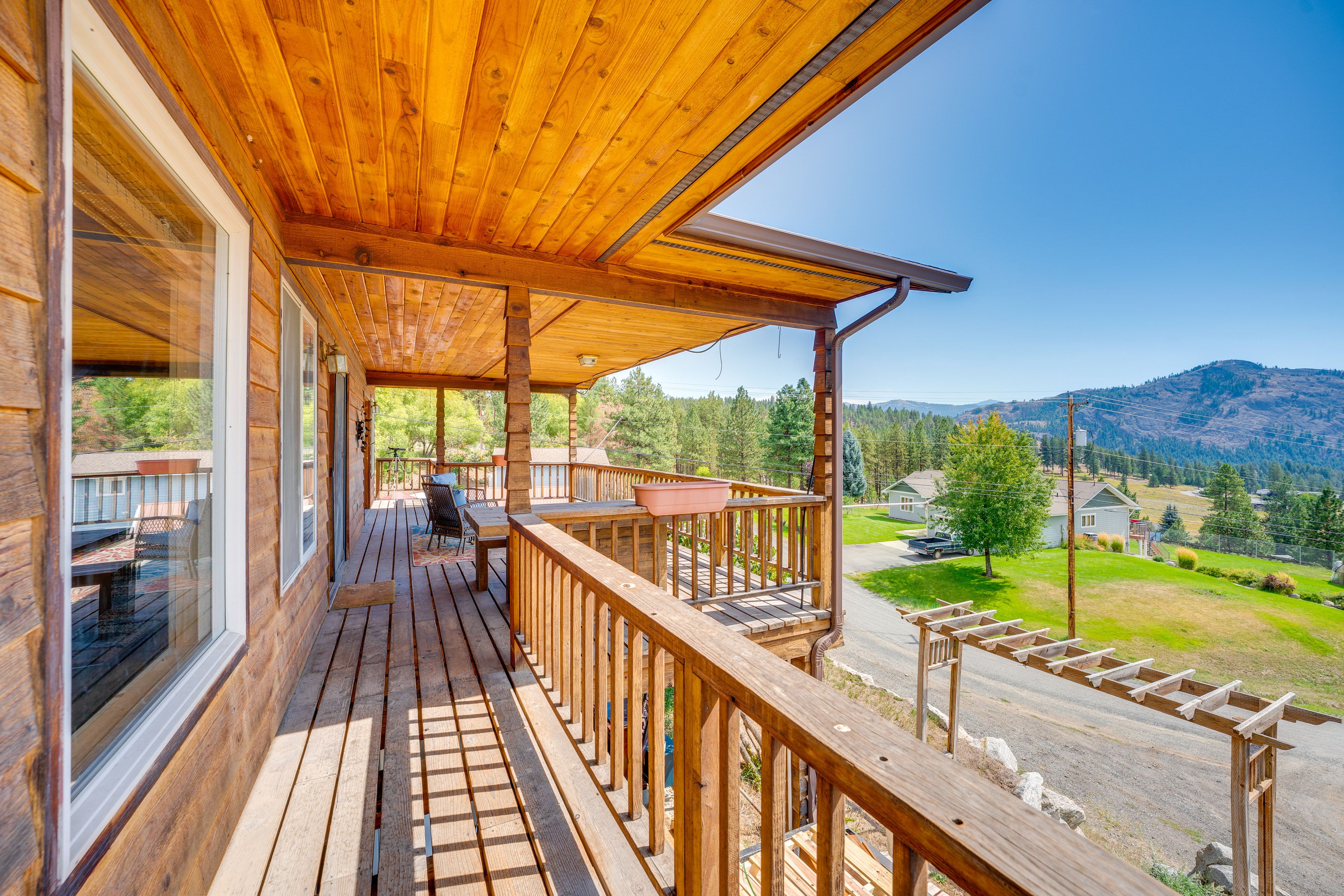 House Exterior | Wraparound Deck w/ Seating | Dining Area | Mountain Views