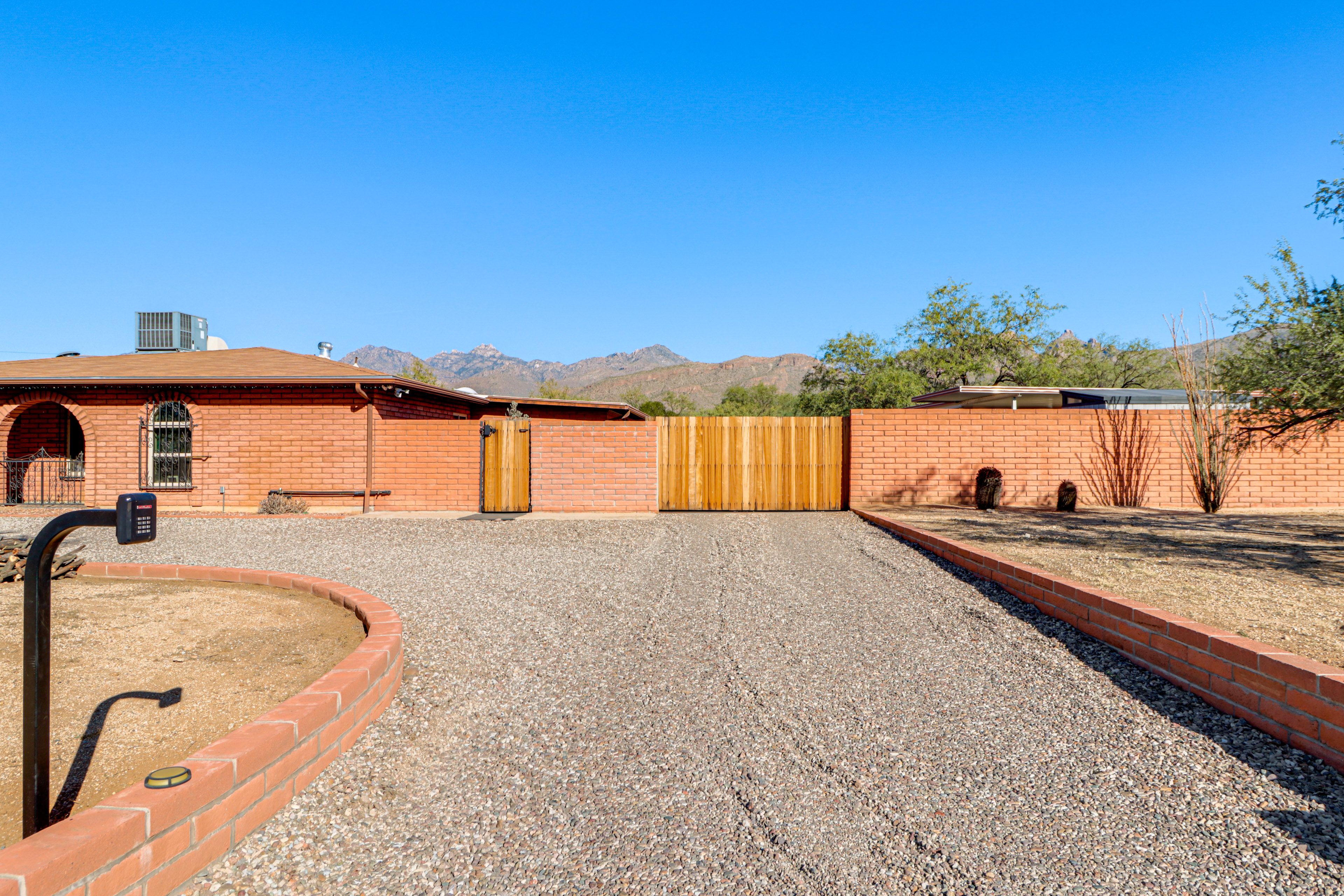 Property Exterior | Parking Pad (2 Vehicles) | Homeowner On-Site (Main House)