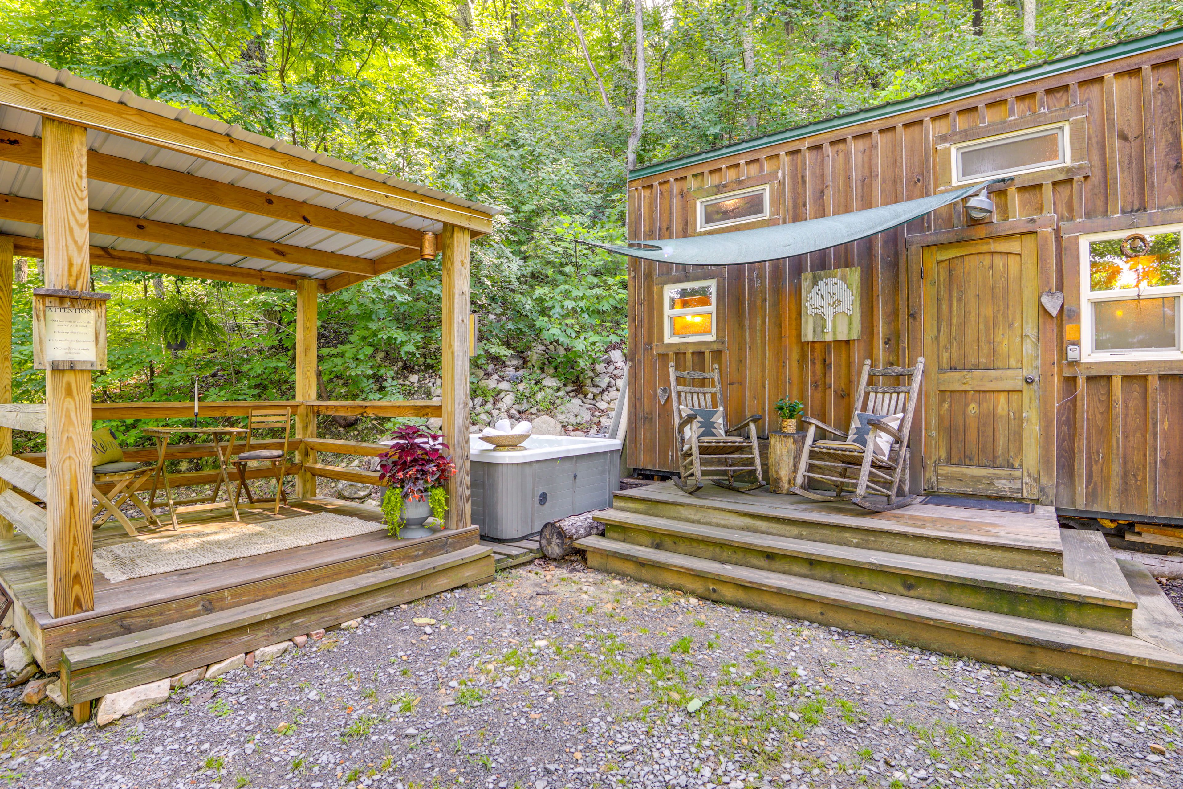 Studio Exterior | Covered Deck w/ Dining Area | Private Hot Tub