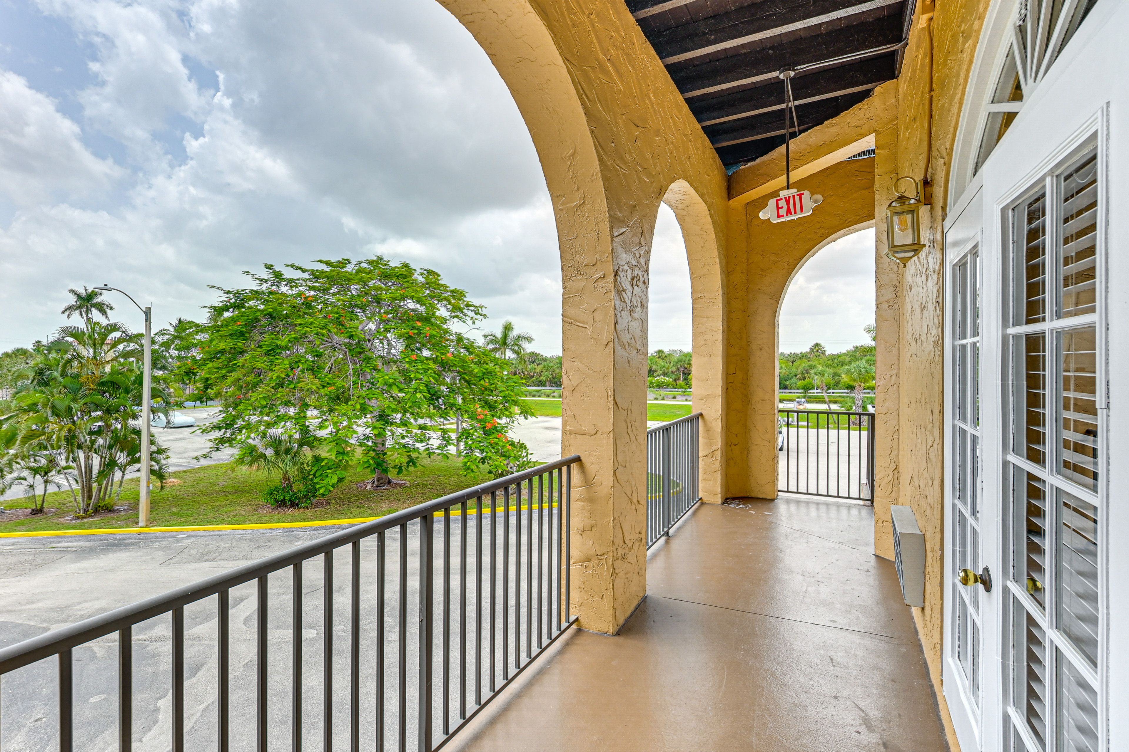 Unit Exterior | Shared Balcony Space | Single-Story Condo