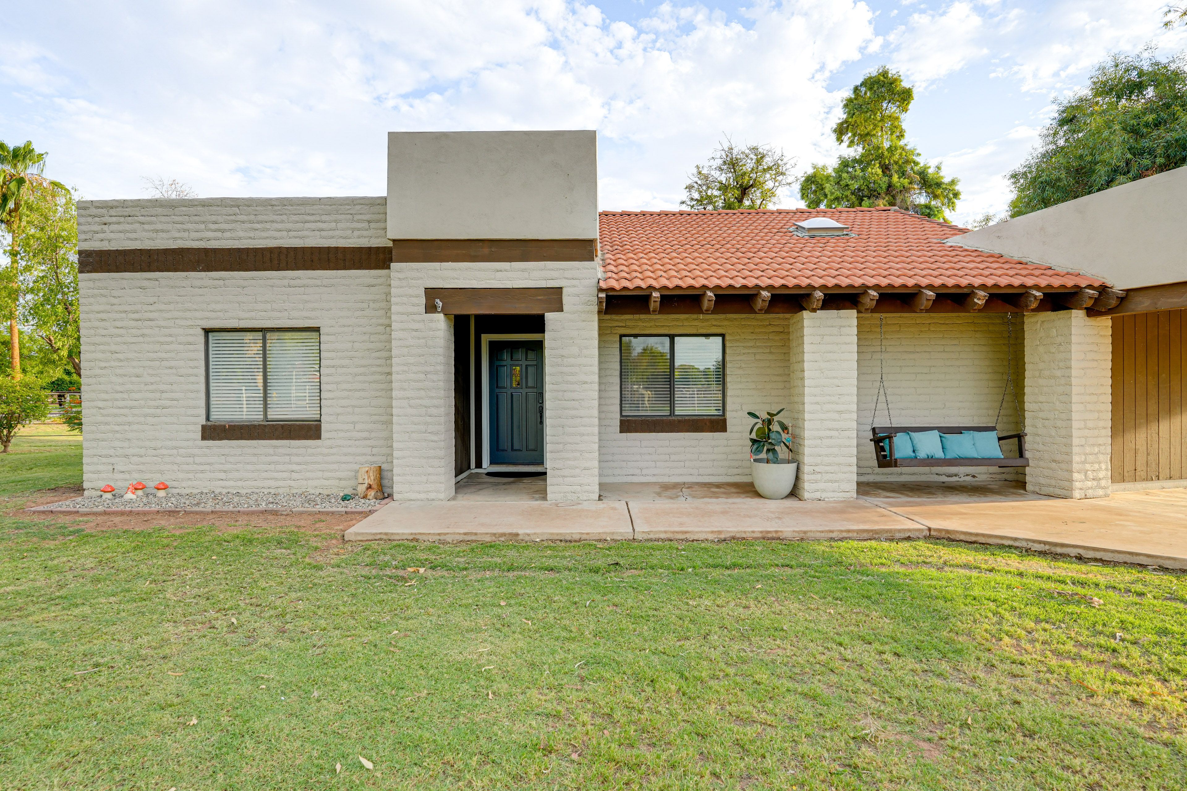 Property Exterior | Single-Story Home | Covered Front Porch w/ Swing