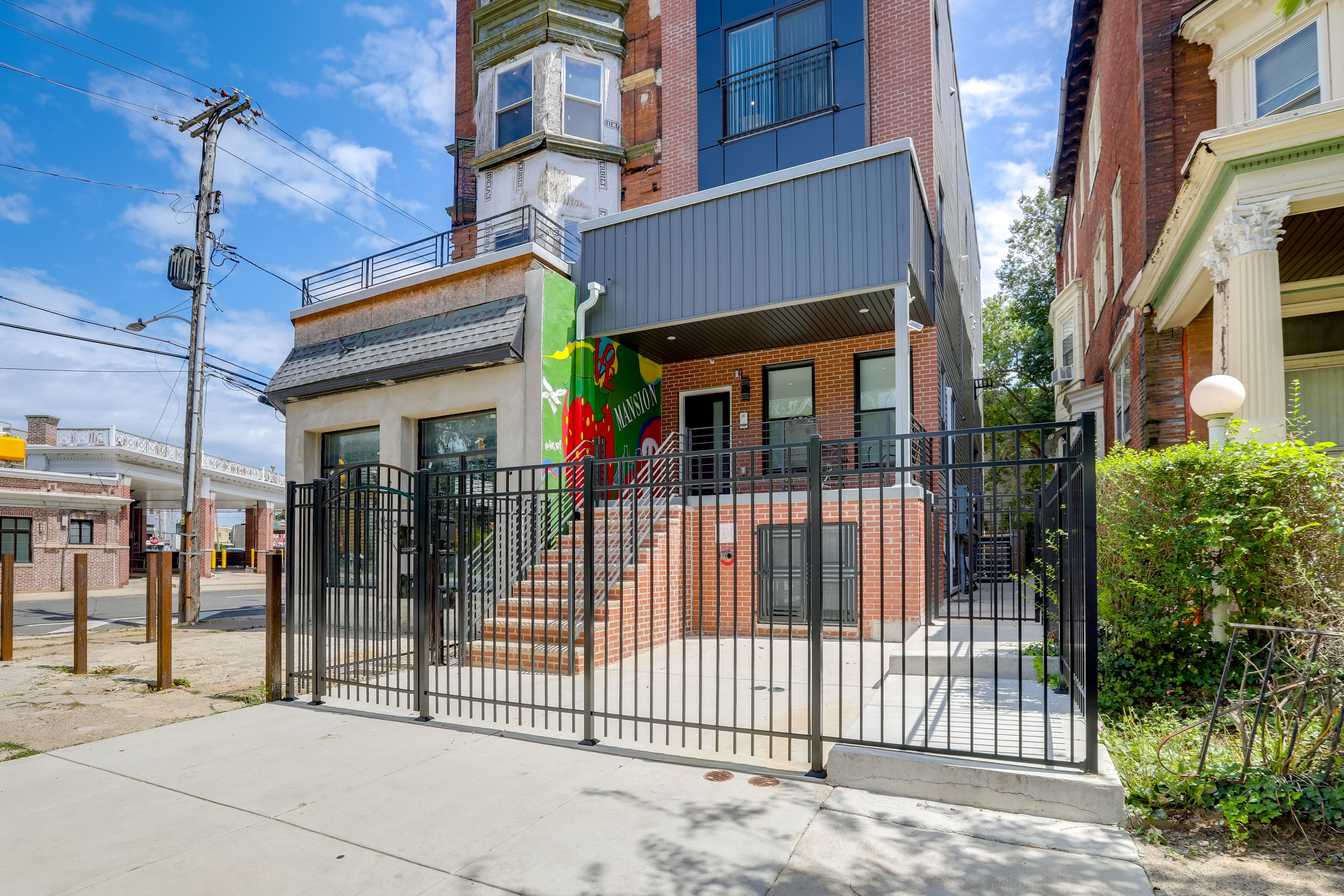 Property Exterior | Single-Story Condo | Rooftop Deck w/ Seating