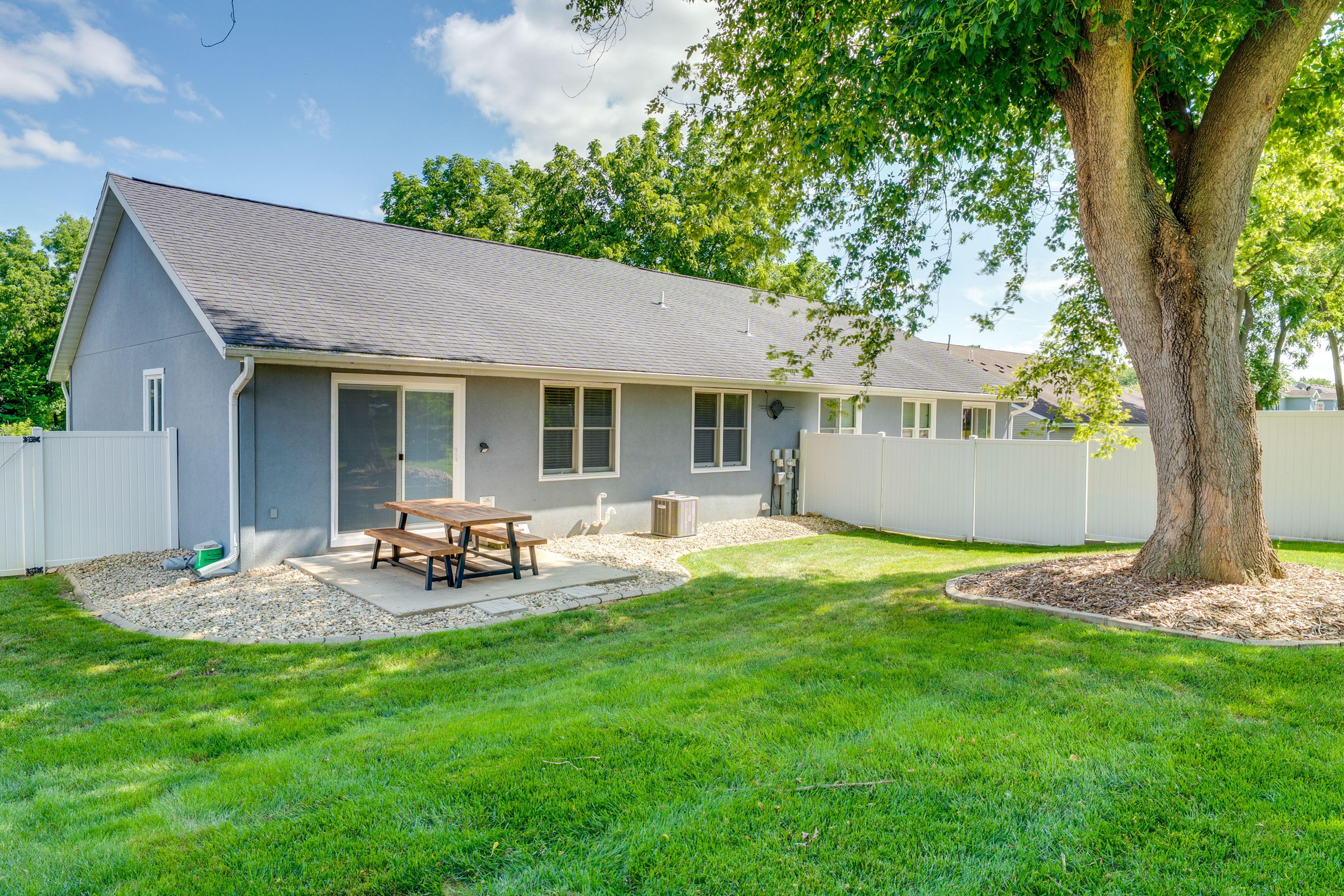 Condo Exterior | Patio w/ Picnic Table | Fenced Backyard