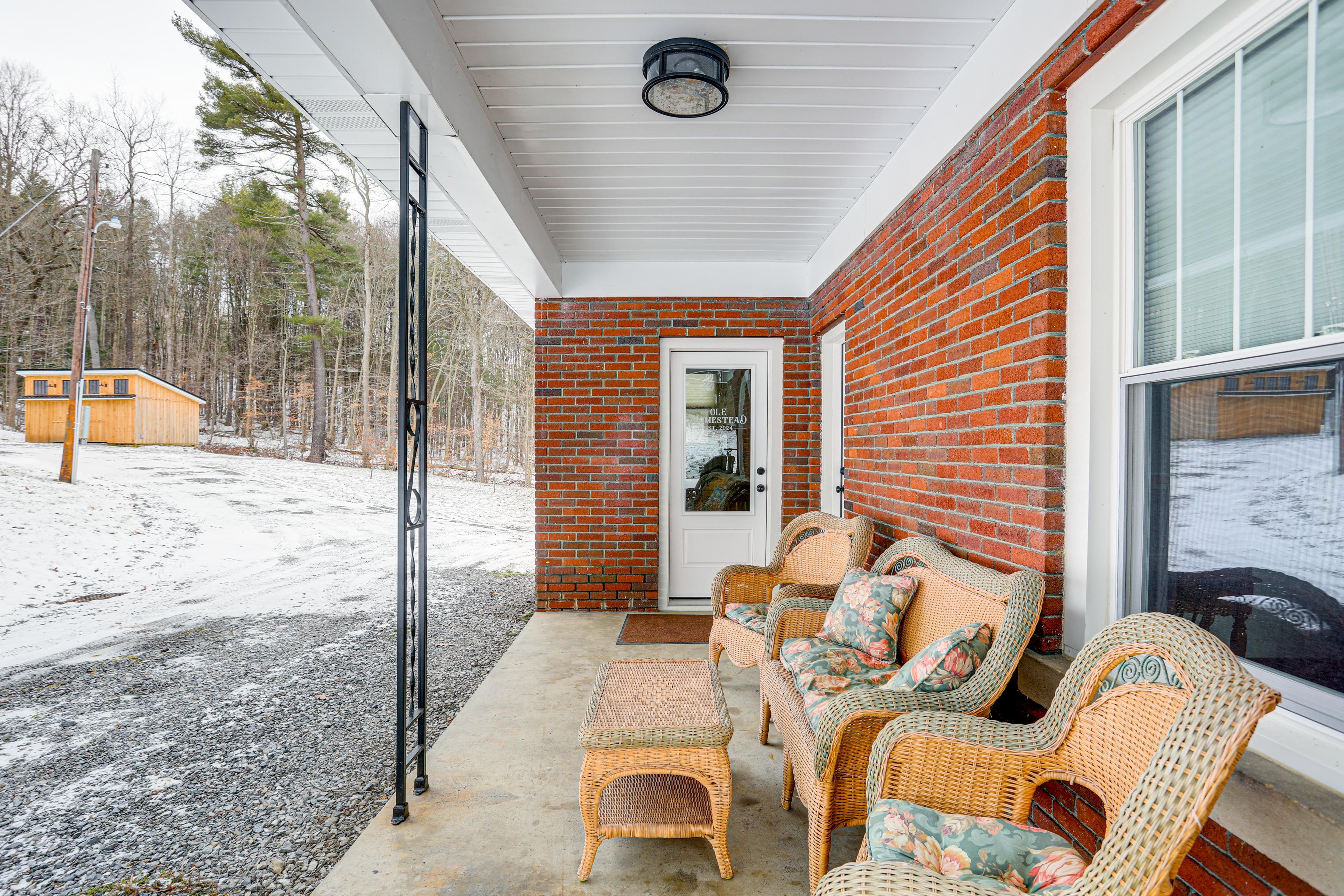 Covered Patio | Property Entrance | Outdoor Seating | Gas Grill