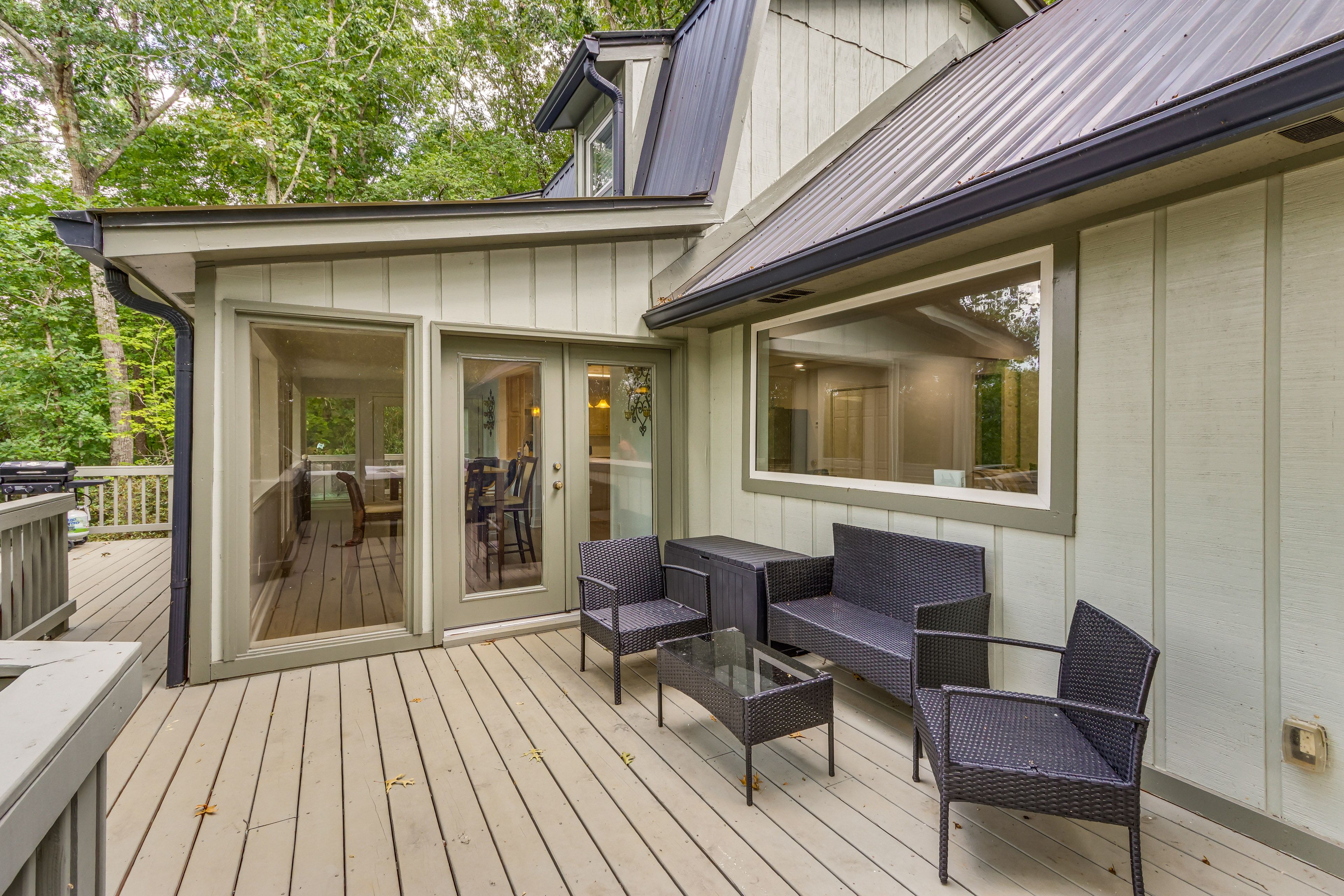 House Exterior | Wraparound Deck w/ Seating | Wooded Surroundings