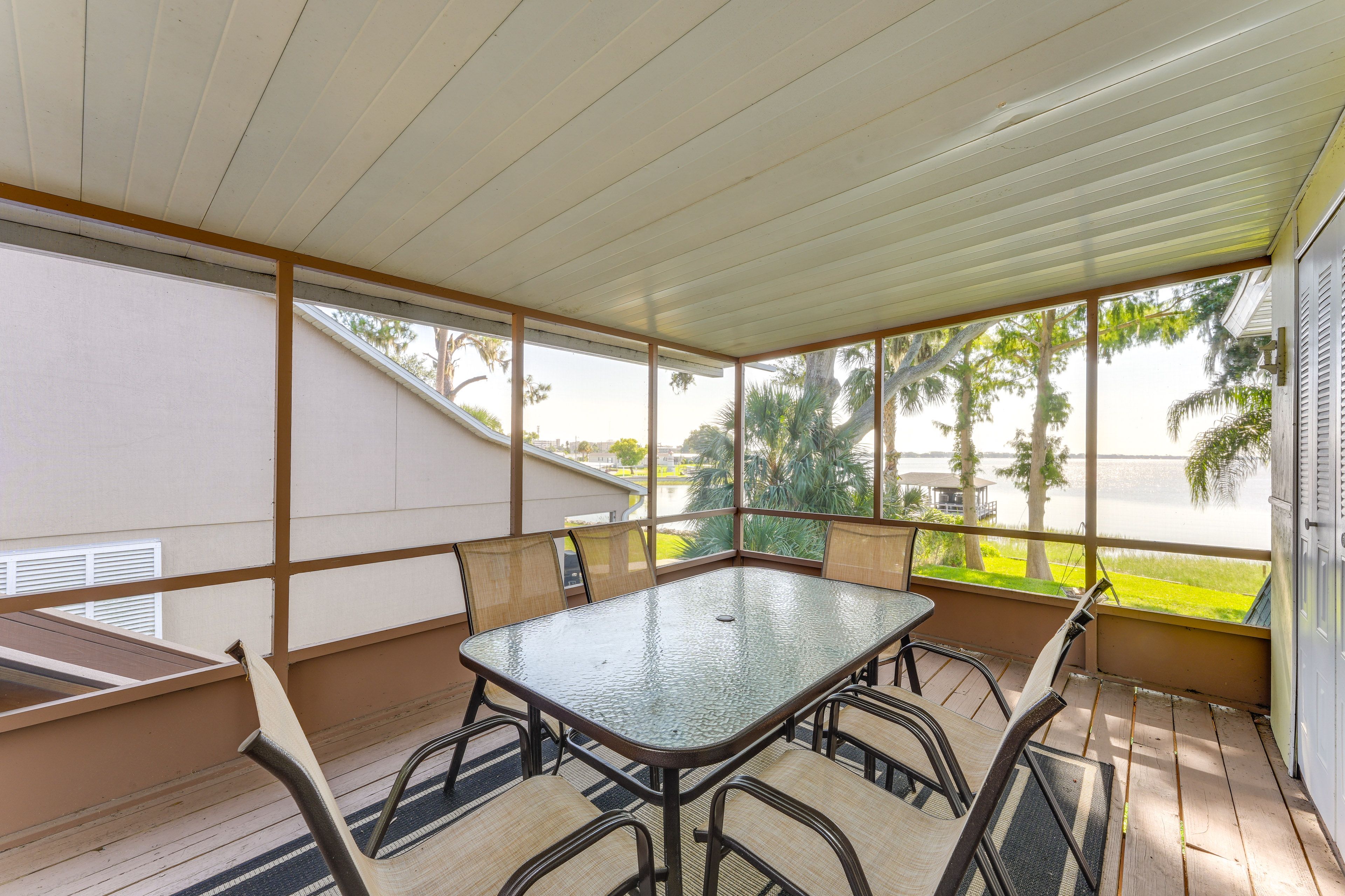 Apartment Exterior | Screened Deck w/ Dining Area