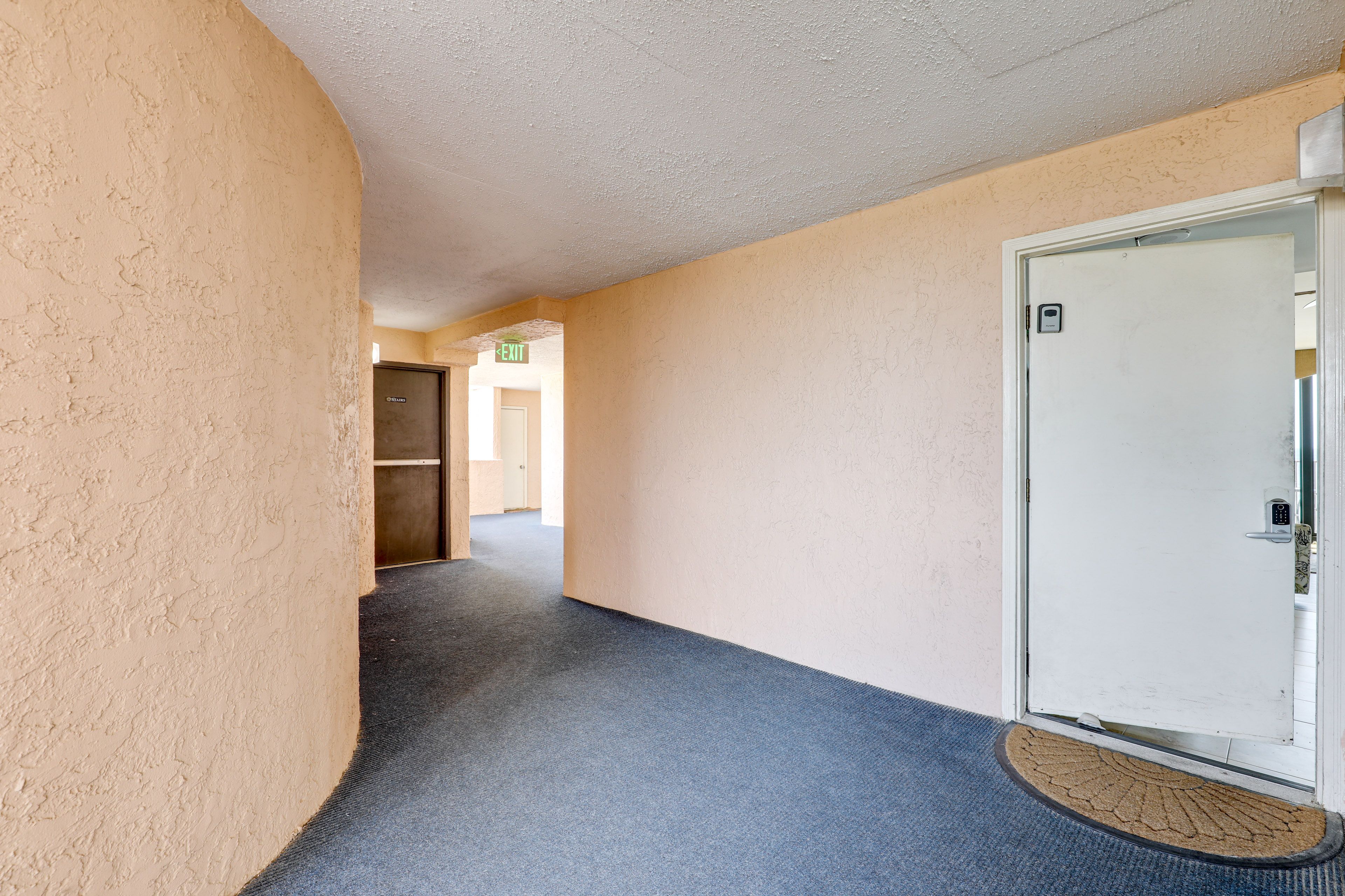 Property Exterior | Single-Level Condo | 5th-Floor Unit
