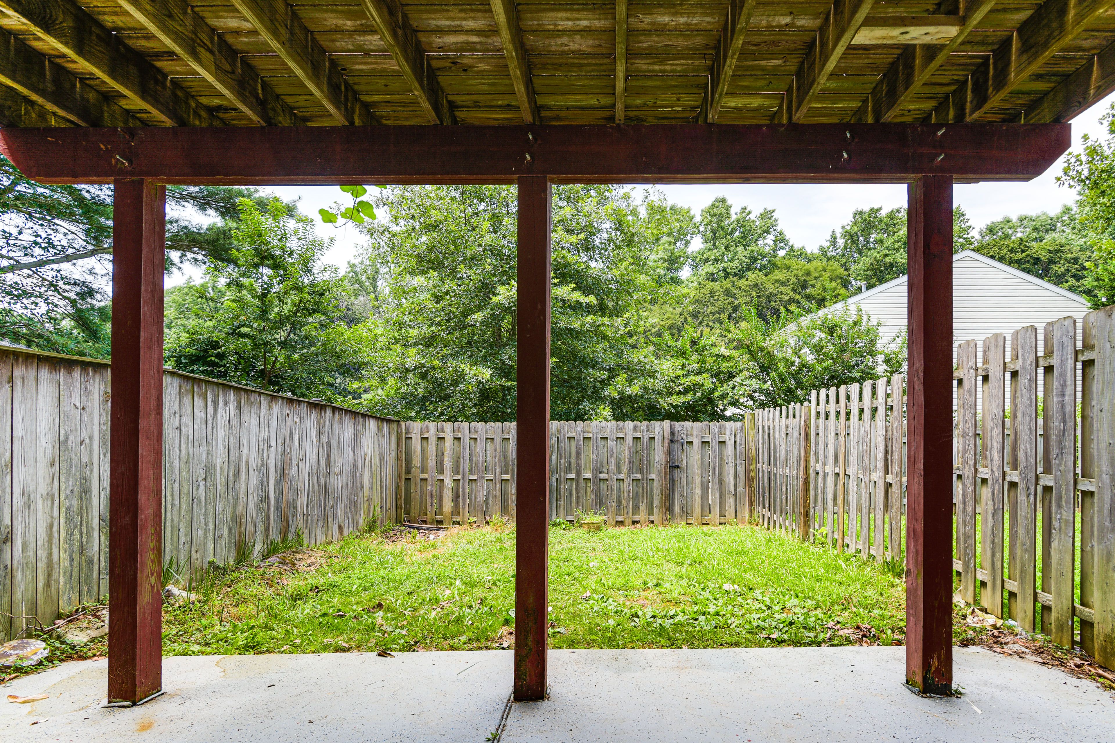 Townhome Exterior | Private Balcony | Covered Patio | Fenced Backyard