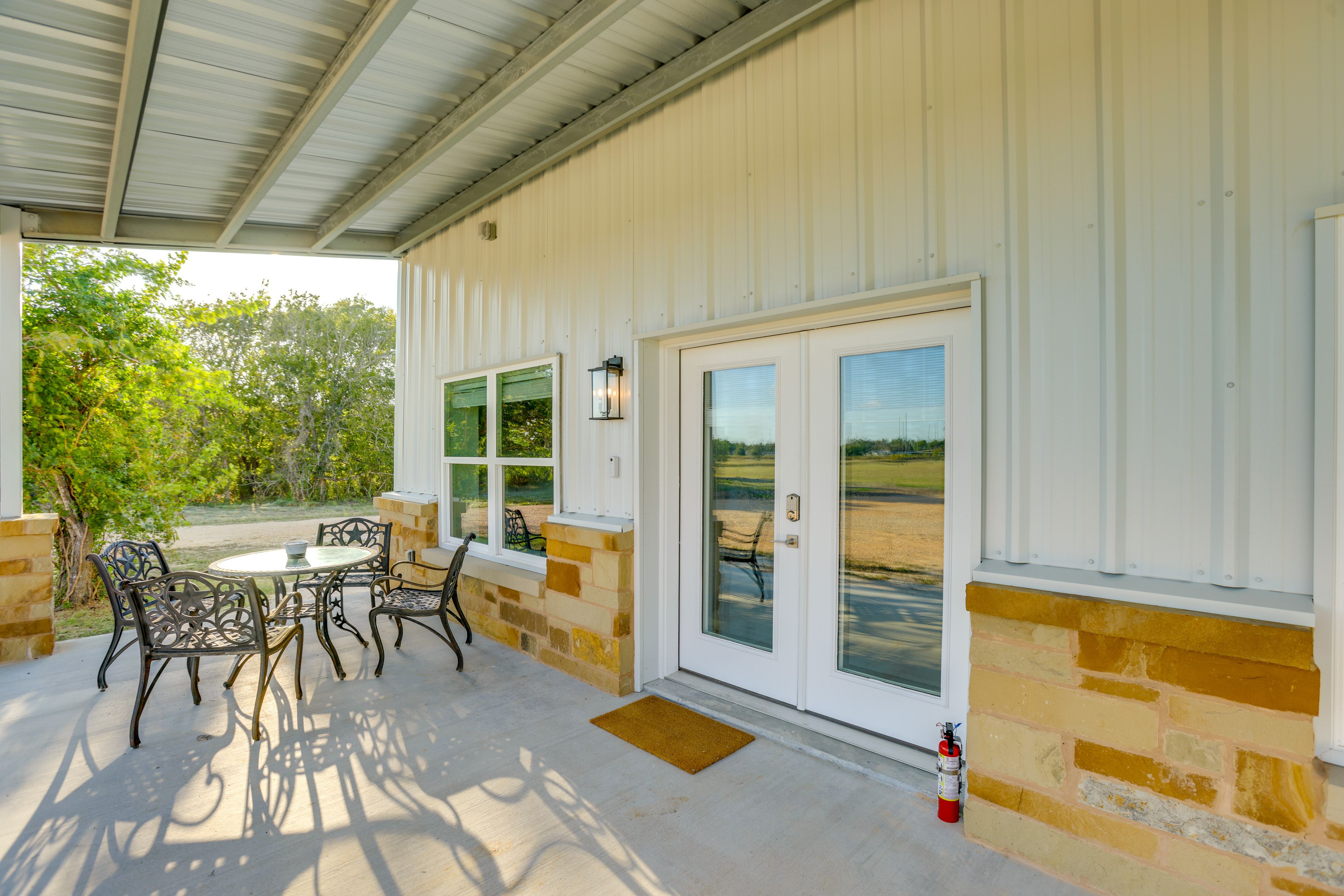 Townhome Exterior | Shared Patio w/ Dining Areas