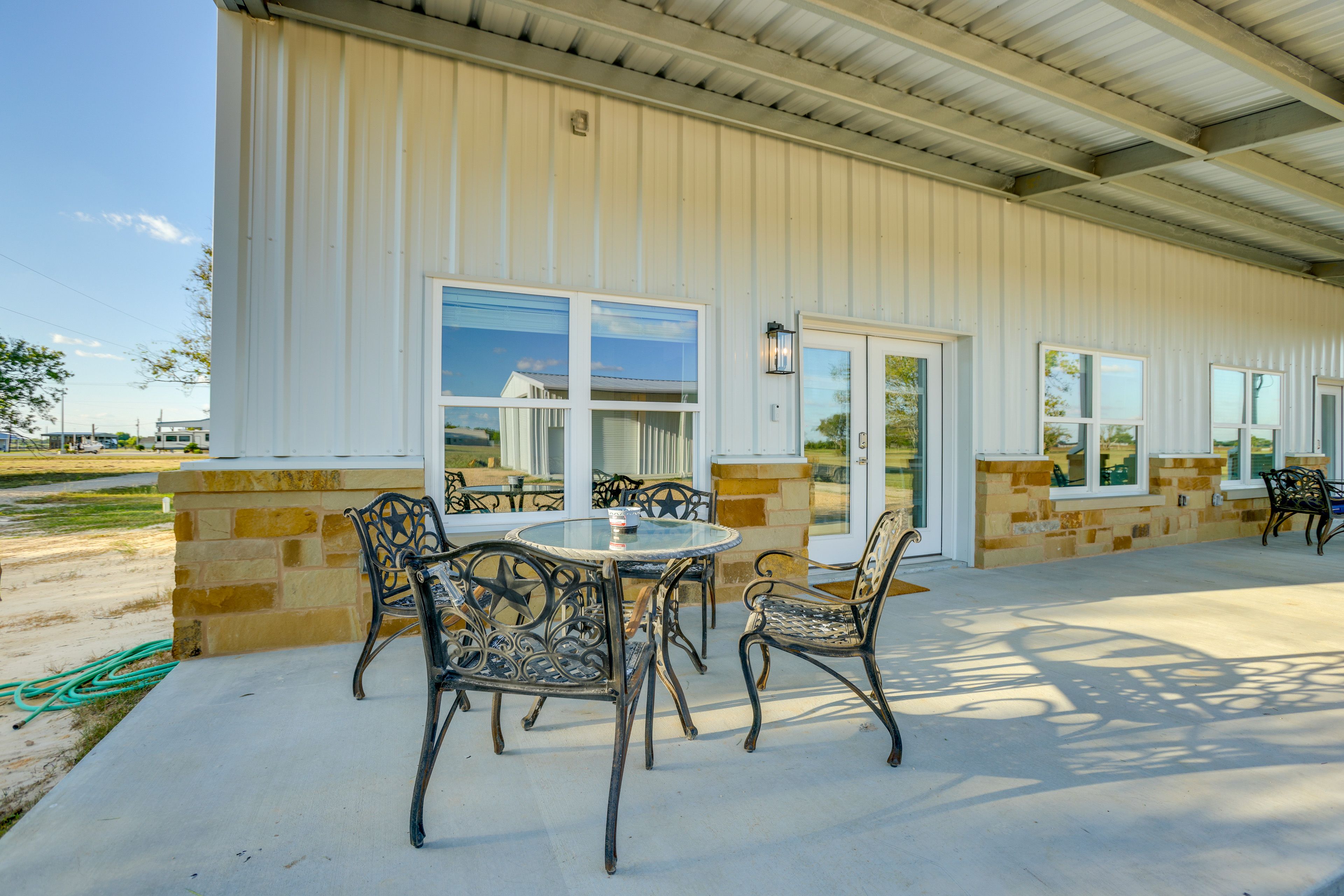 Townhome Exterior | Shared Patio w/ Dining Areas