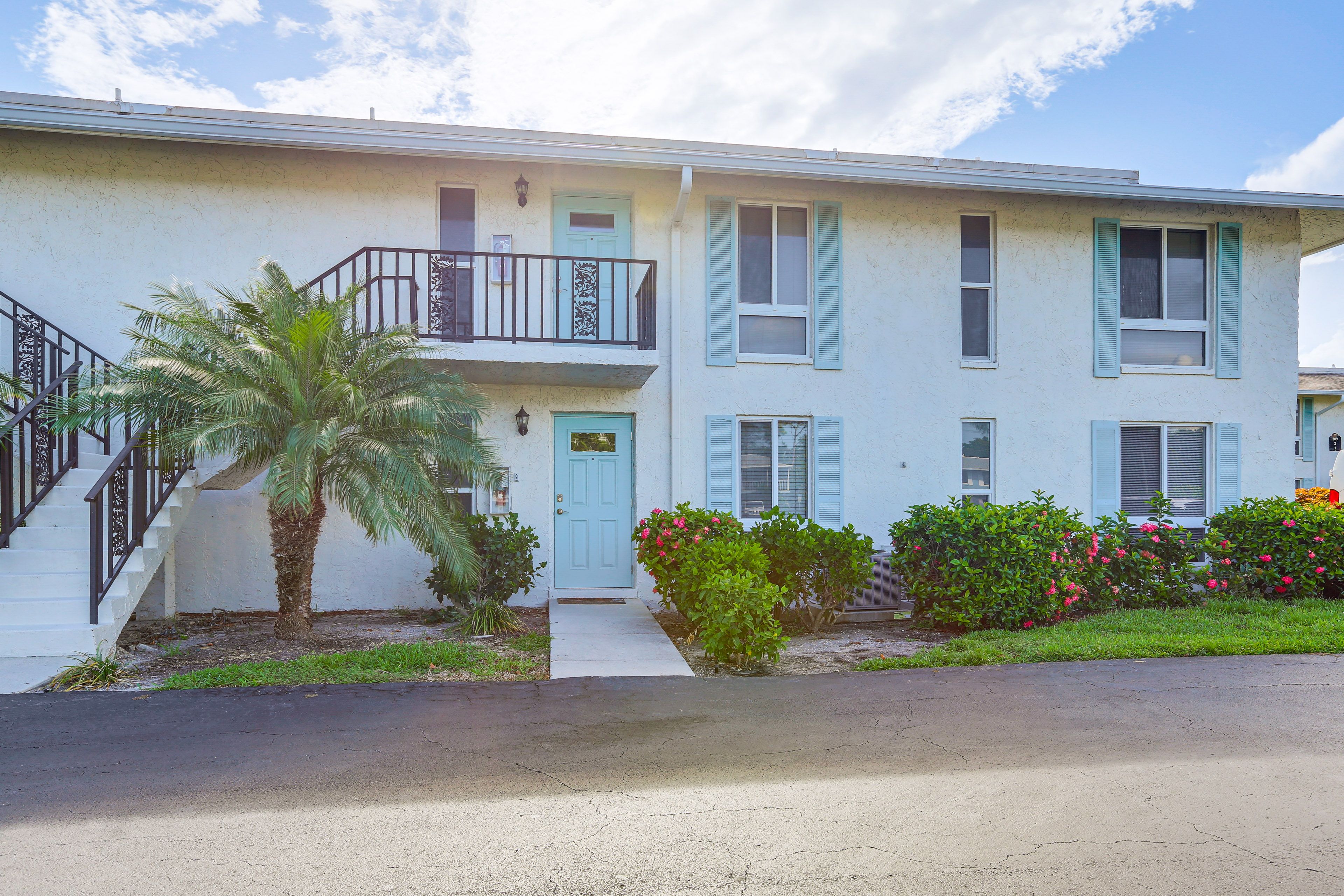 Condo Exterior | Single-Story Unit | Surface Lot (2 Vehicles)