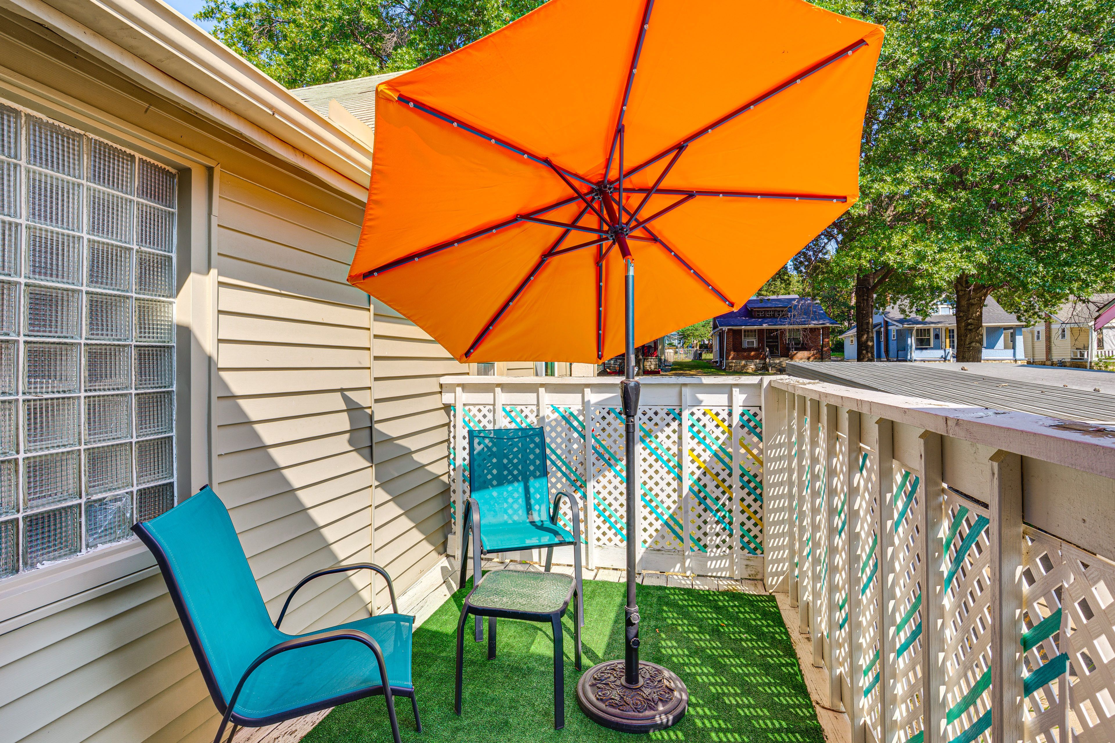 House Exterior | Furnished Balcony w/ Umbrella